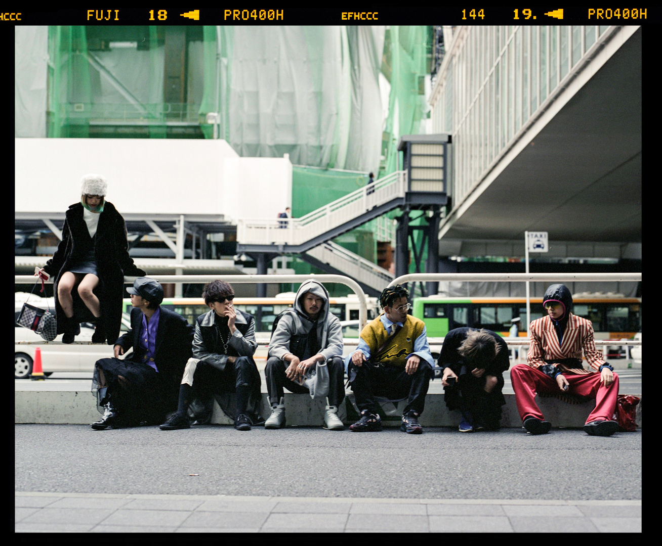 Group of young Japanese enjoying the fashion week in Shibuya