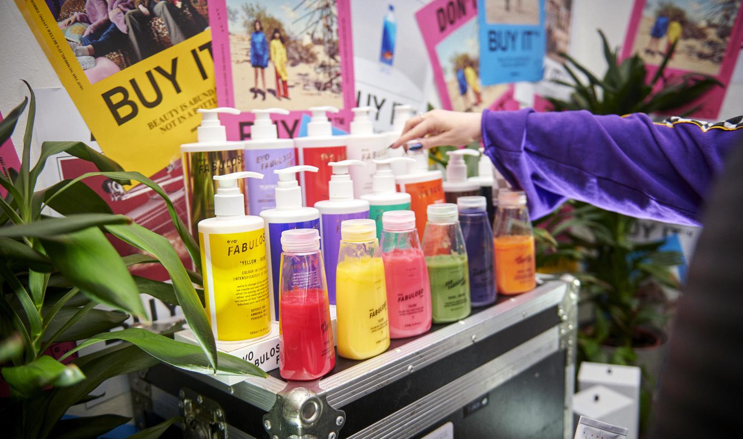 EVO Hair product display featuring colourful bottles of Fabuloso colour conditioners.