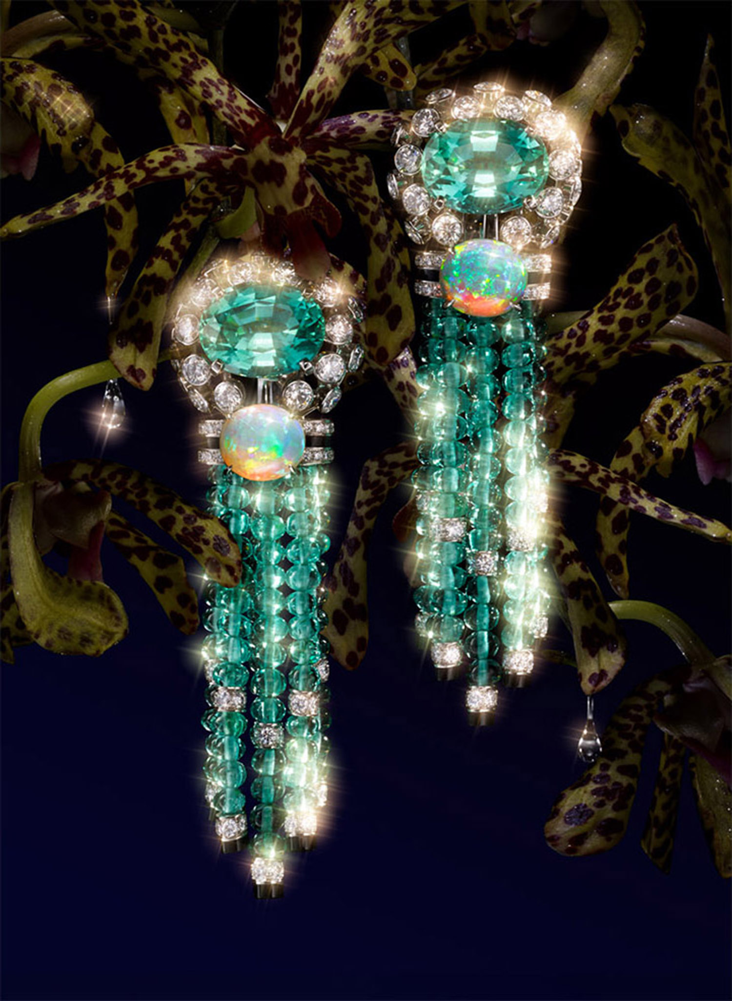KMA stylist Sara Wacksman designs set for a photo of dangly emerald earrings against dark colored plants for Vogue Mexico 