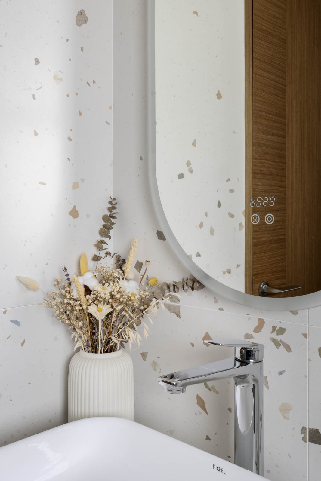 I love how the colors of the speckled terrazzos matched with the dried flowers too