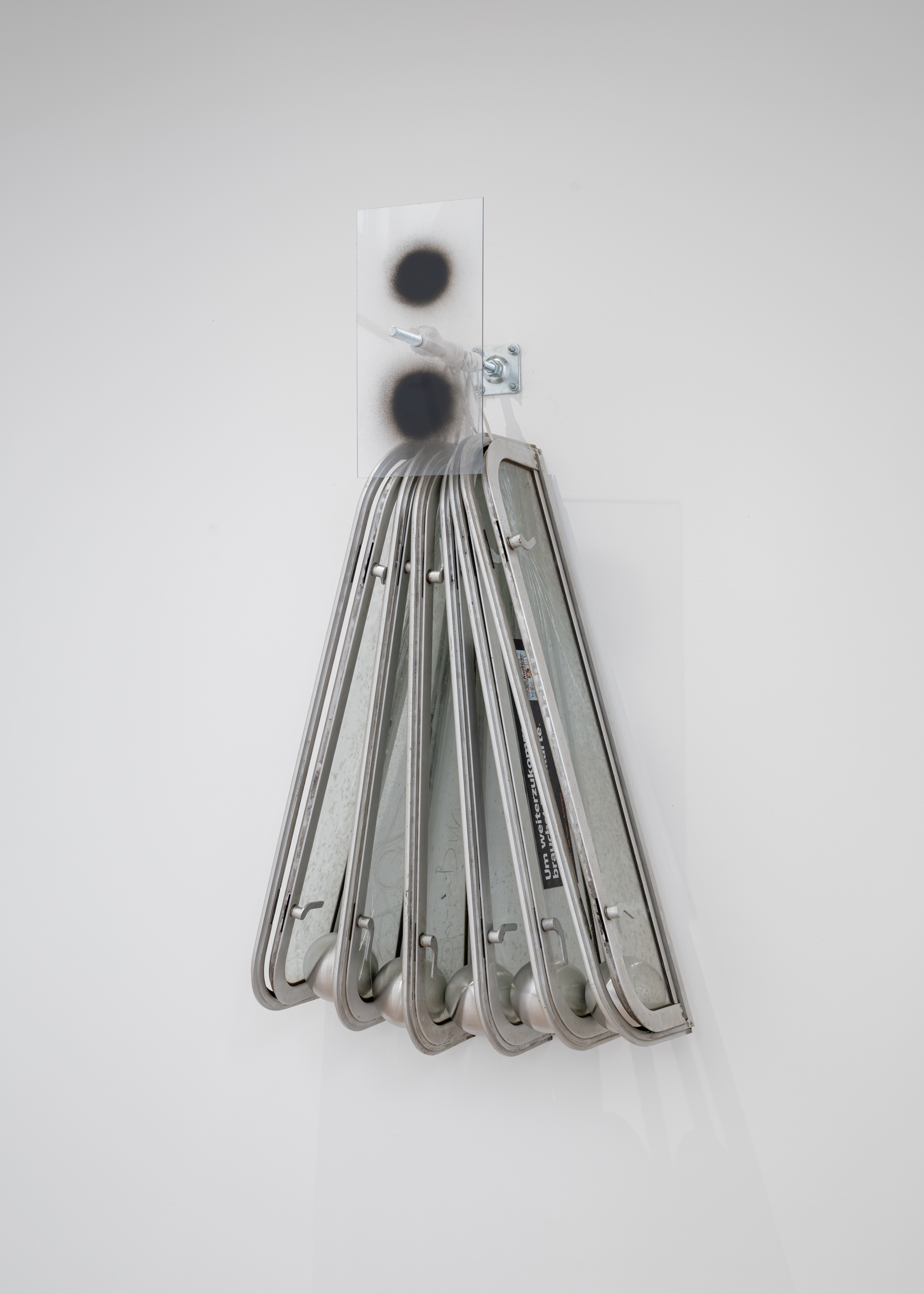 Fuel I, 2025, subway window, steel balls, acrylic glass, and spray paint, 160 x 100 x 50 cm 