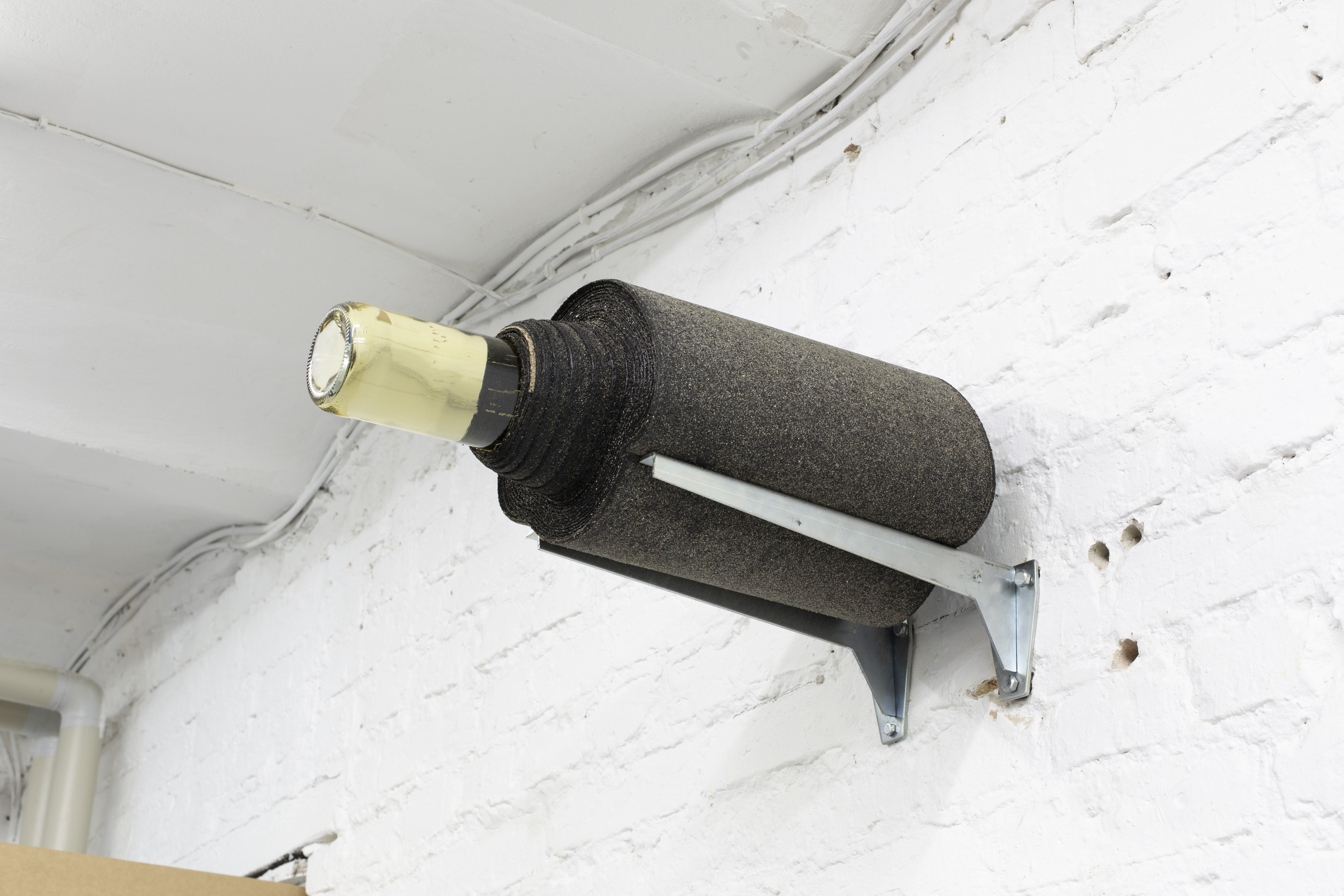 Gift (etc), 2022, Wine bottle, Asphalt. 70 x 45 x 32 cm