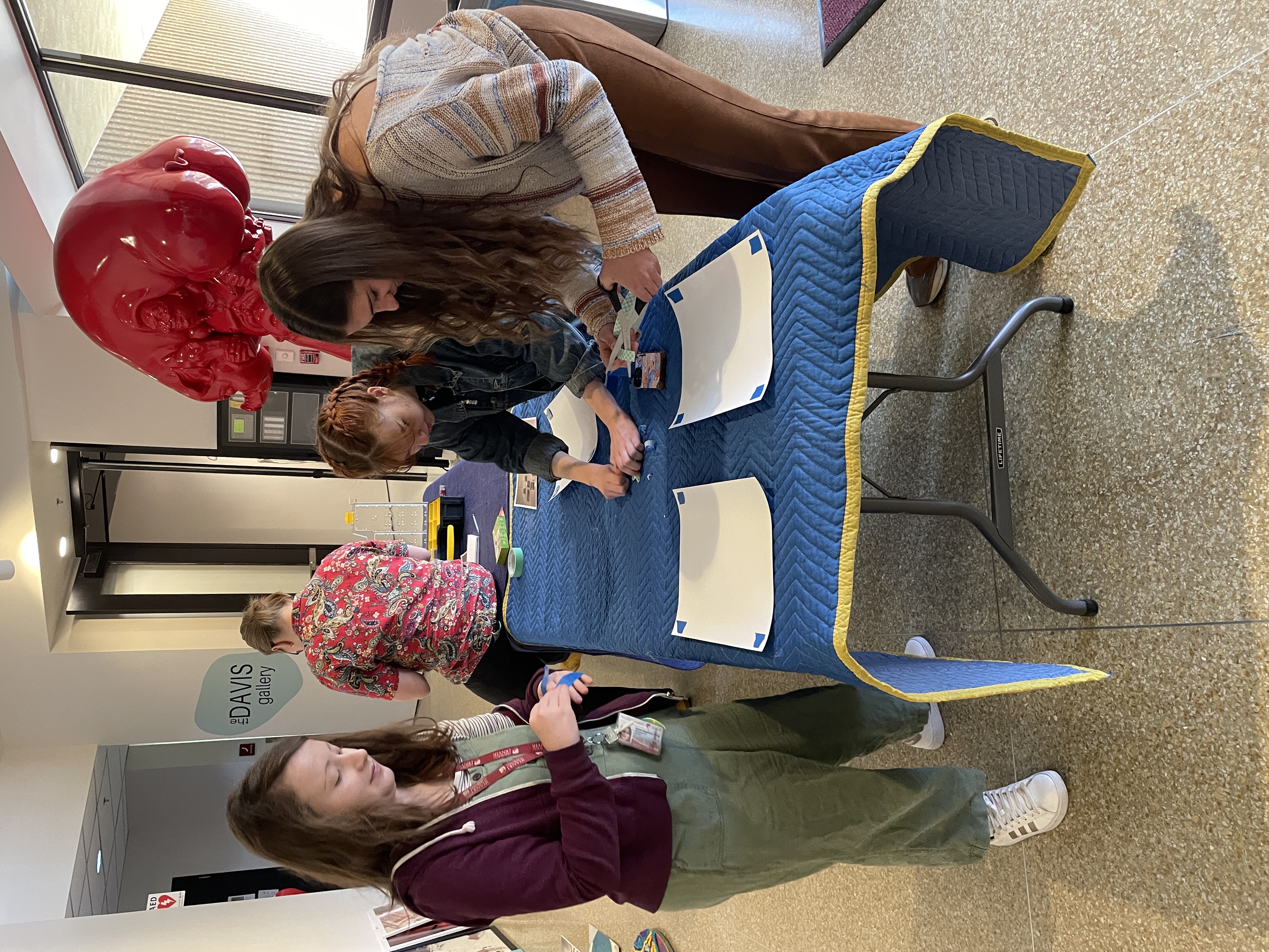 Students installing their final exhibition