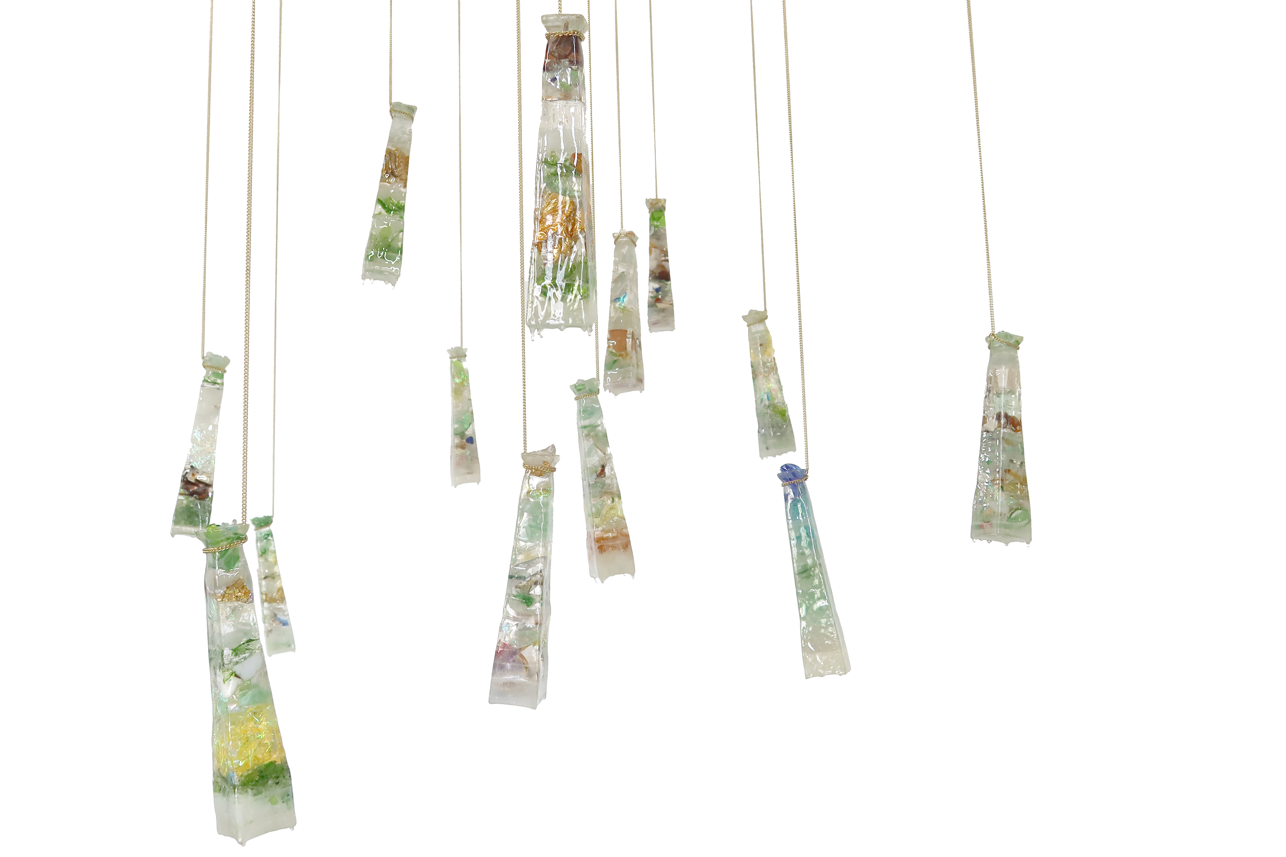 13 Seaglass Stalactites chain, detritus, resin and inherited sea glass 2.5” x 2.5” x 11” each, chain length varies $300 each