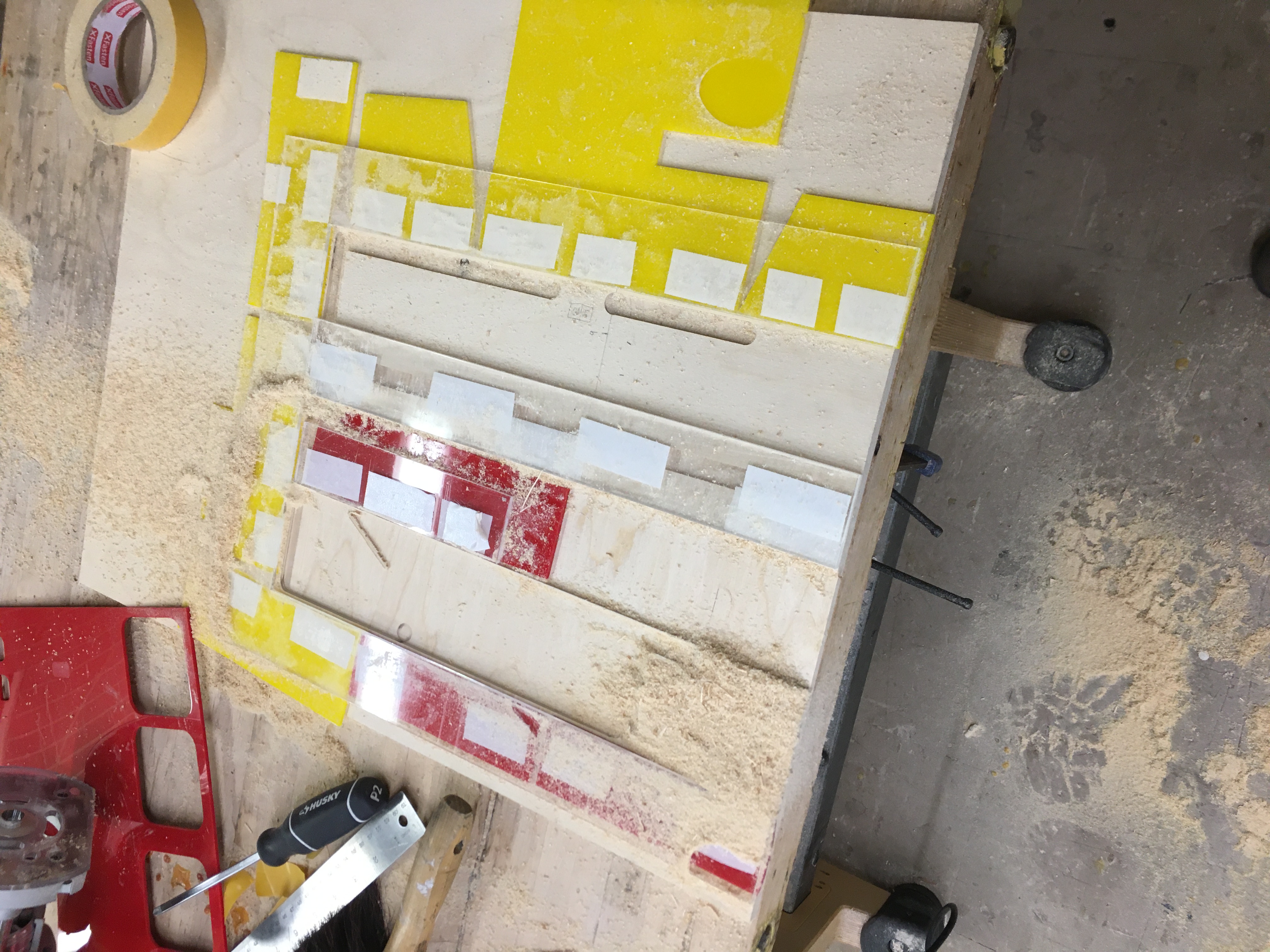 Router guide for walnut slab's pocket on the table top.