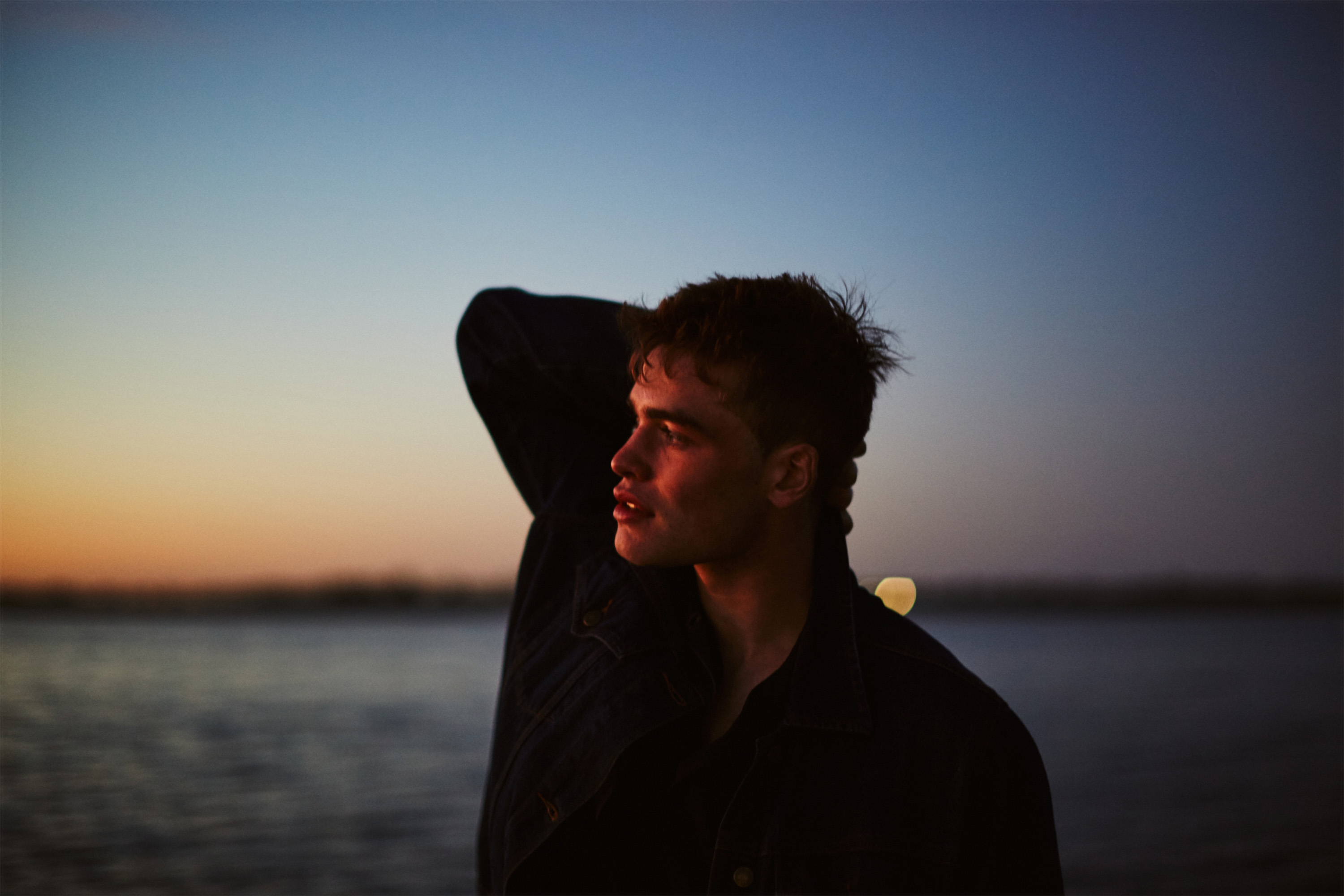 Portrait of model at blue hour, photographed by Dublin based lifestyle, fashion, and advertising photographer Alex Sheridan for
