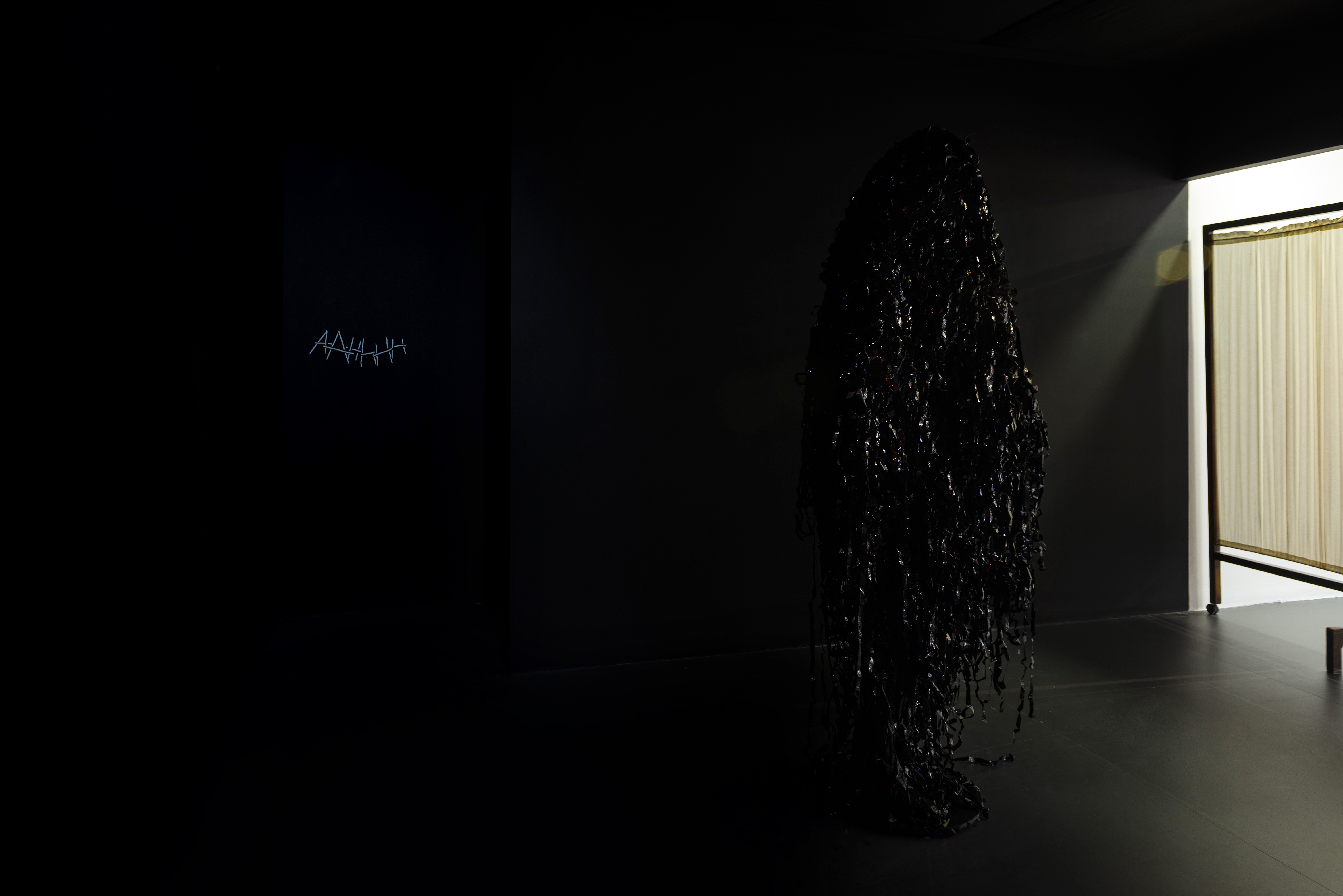 Özgür Erkök Moroder,  AHHhH  (voices we hear in the dark just for a moment), 2018 Reflector textile band, hot glue&. “Otozit-Parazit”, 2010. Video tape, tape, costume for sesperisi performance tour “Otozit- Parazit”, iaab artist residency. 