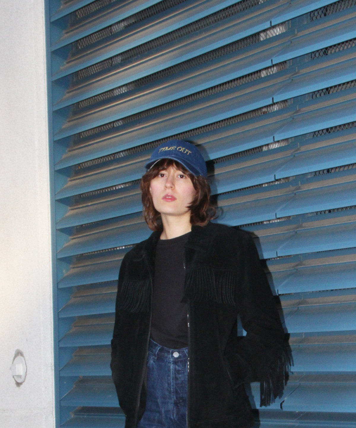Laura wearing the Time Out baseball cap