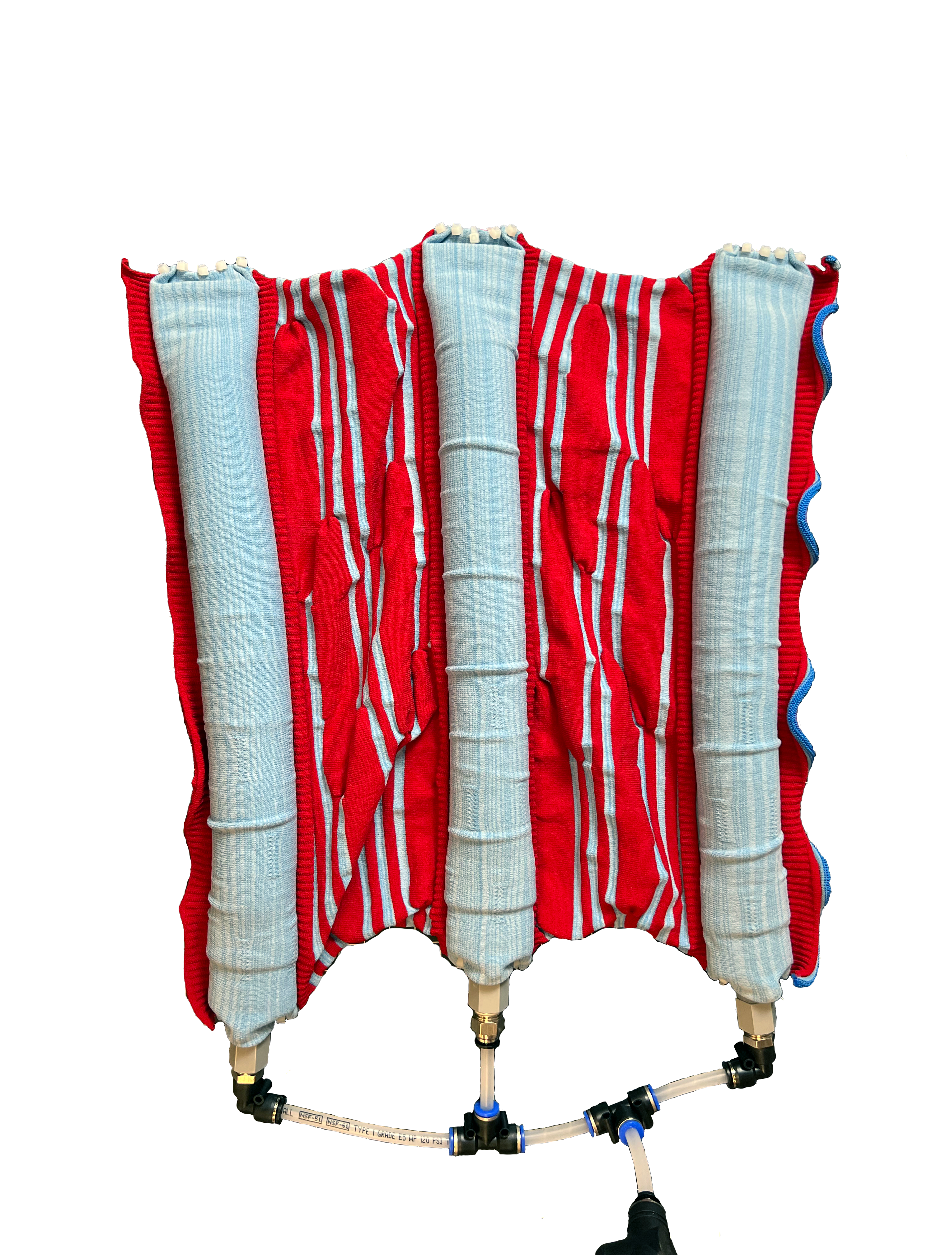 The final knit pneumatic form with the inset custom silicone bladders and tubing to connect to external compressor.