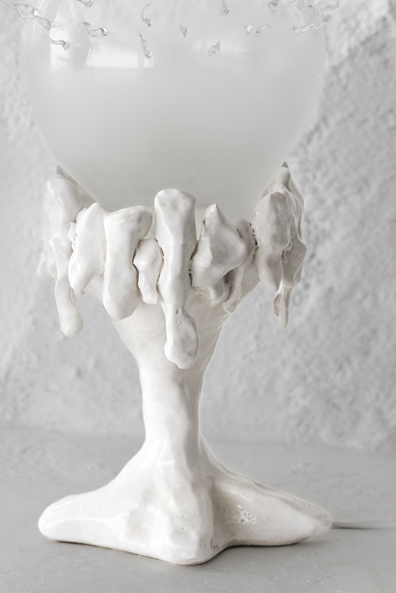 White  Porcelain and Blown Glass Lamp from Plaja Studio in front of white background, product photography, 