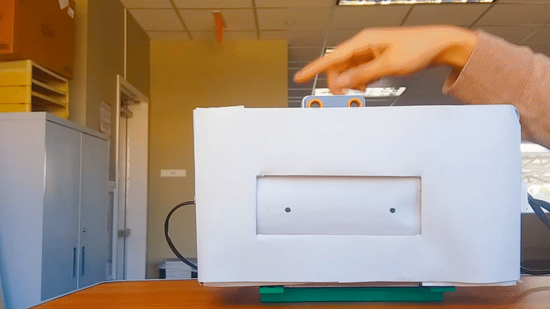 A small mechanical toy with stop motion animations inside.