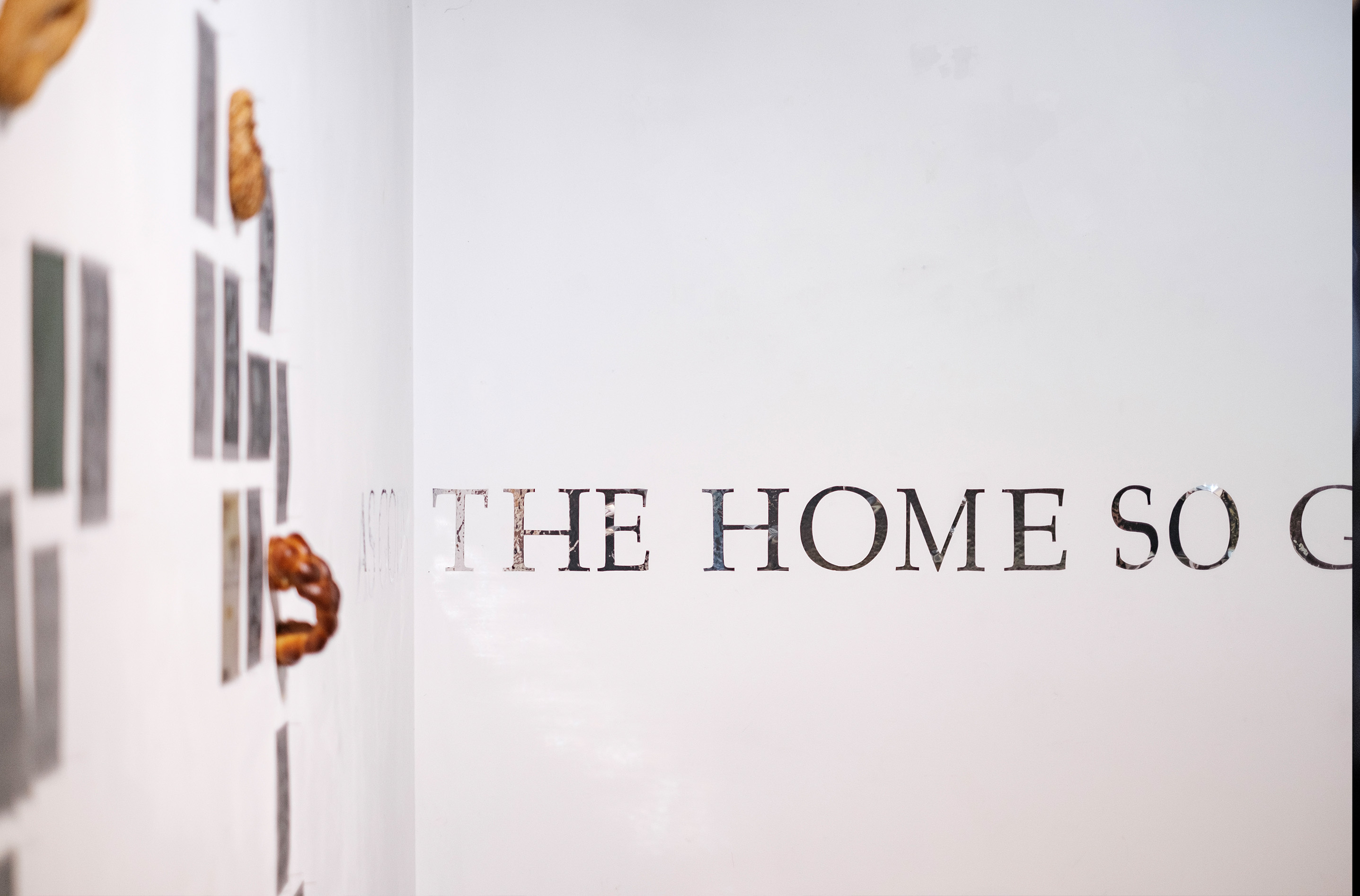Mirrored wall decal spalls out the Emily McPherson College motto: As Goes The Home, So Goes The Country. Photograph by Temitope Adesina