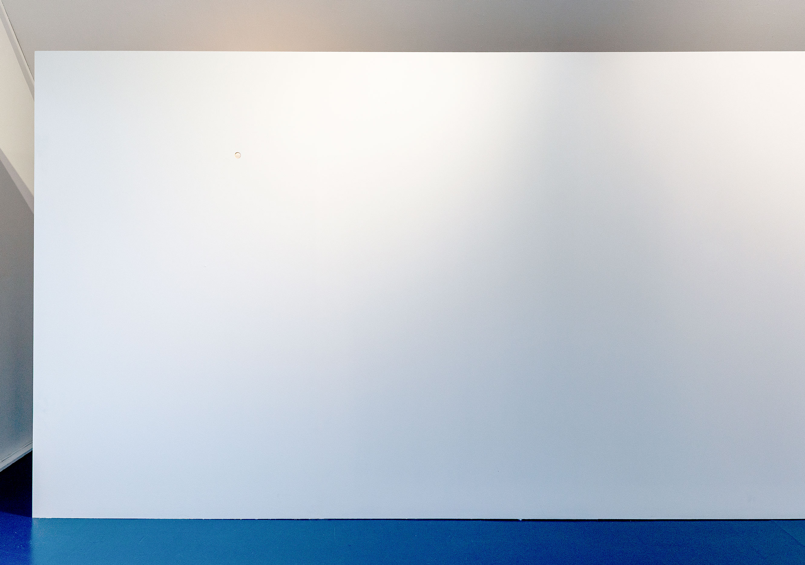 'The Descent of Apollo' (2025) &ndash; Installation view with hole in gallery wall.