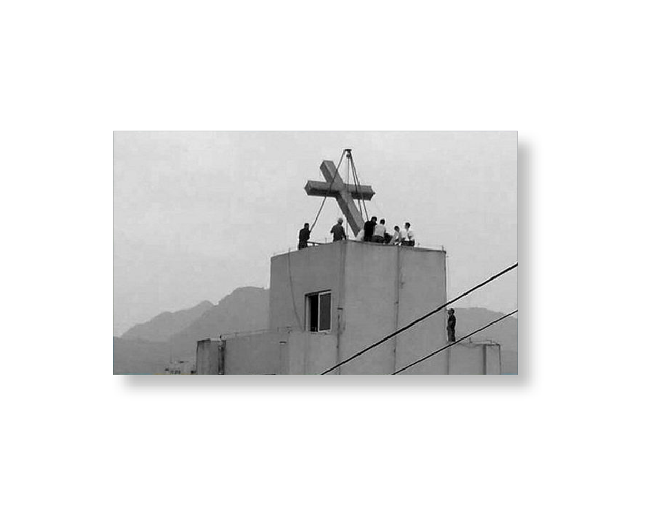 Cross being removed from a church in Henan, China, 2016.