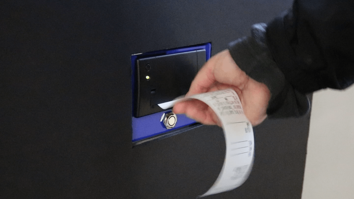 pulling ticket from kiosk