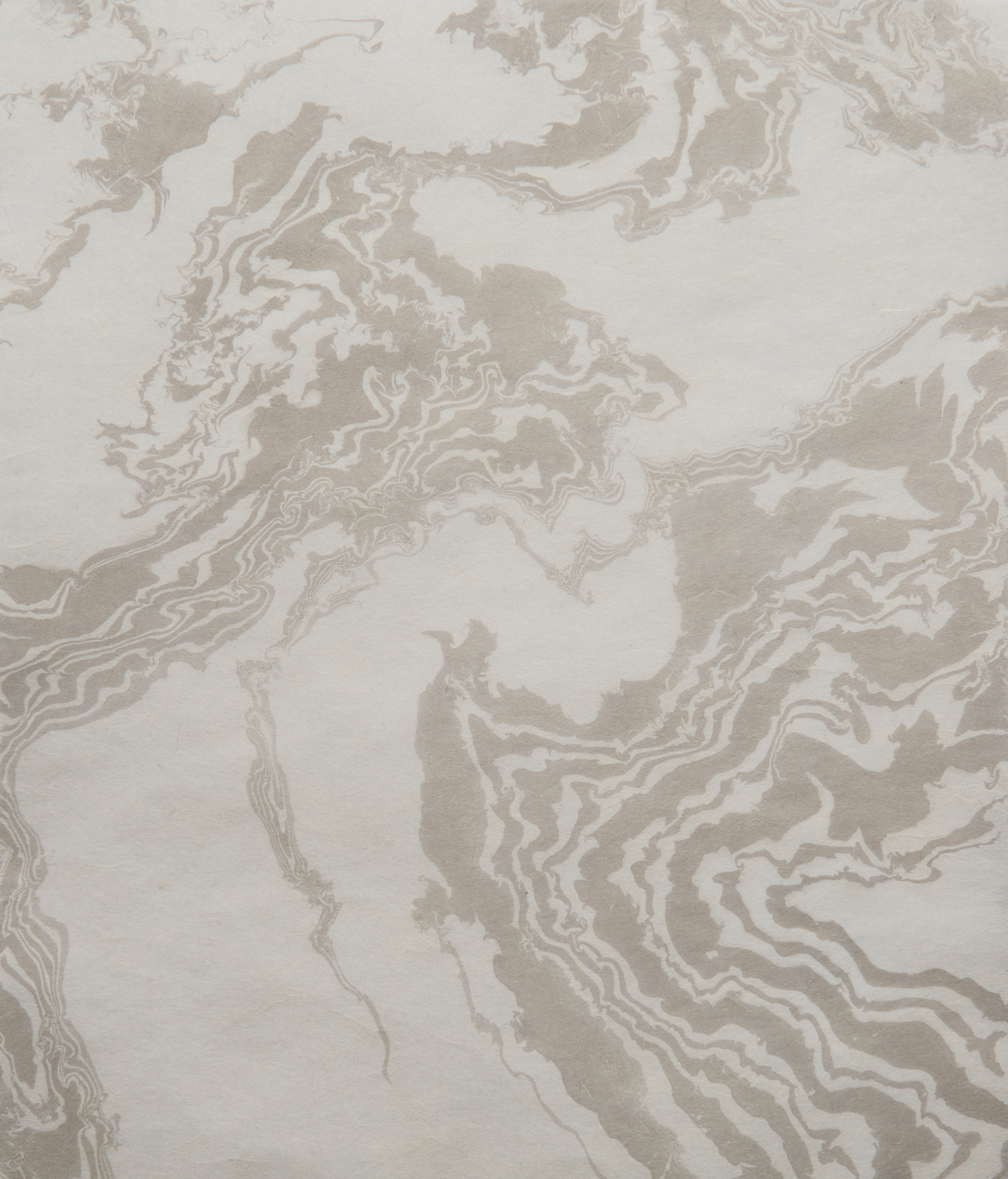 Suminagashi marbling created by blowing or fanning ink on the surface of water and then fixed onto delicate Japanese paper.