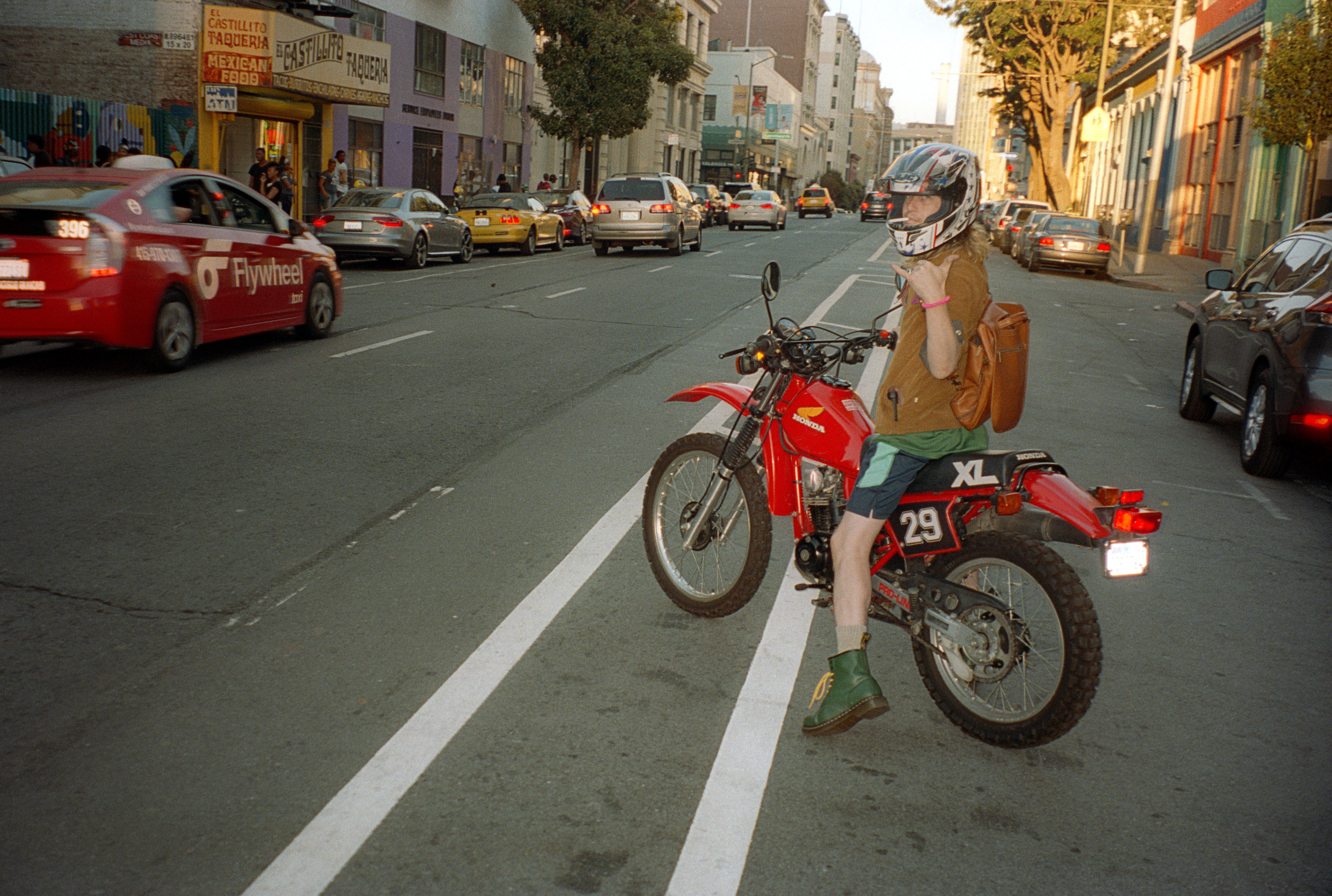 Riding one of his many motorbikes, Tenderloin, San Francisco, 2016.