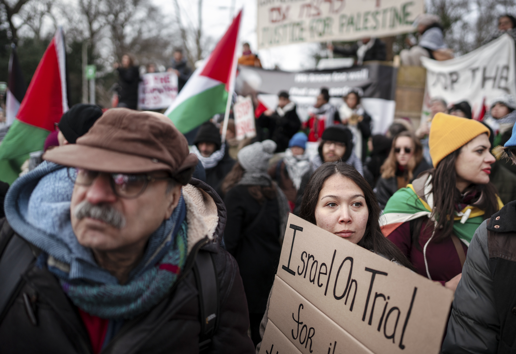 Pro-Palestinian demonstrators gather to watch a live stream of the court case at the Peace Palace in The Hague.