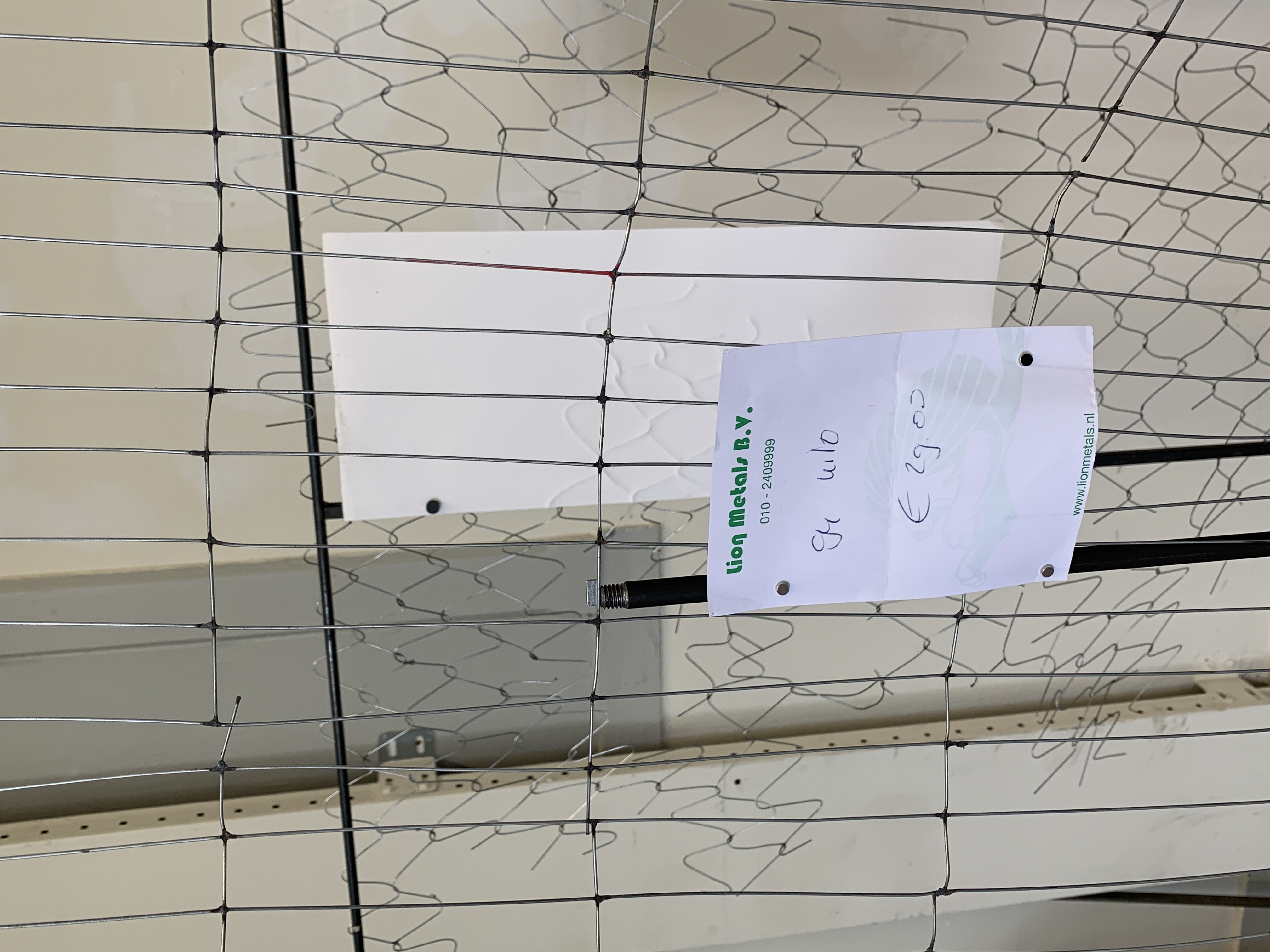 detail of Problematic Separation. 2022, hand-woven wire, embossing and steel, scrap metal receipt, dims variable