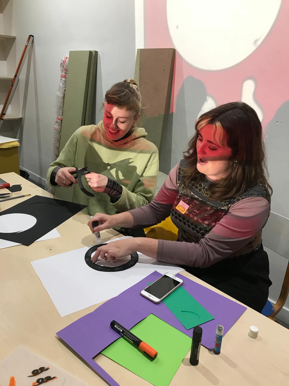 Kirsty Purnell and Kate Ducker making a poster for their dance workshop The Circle Dance.