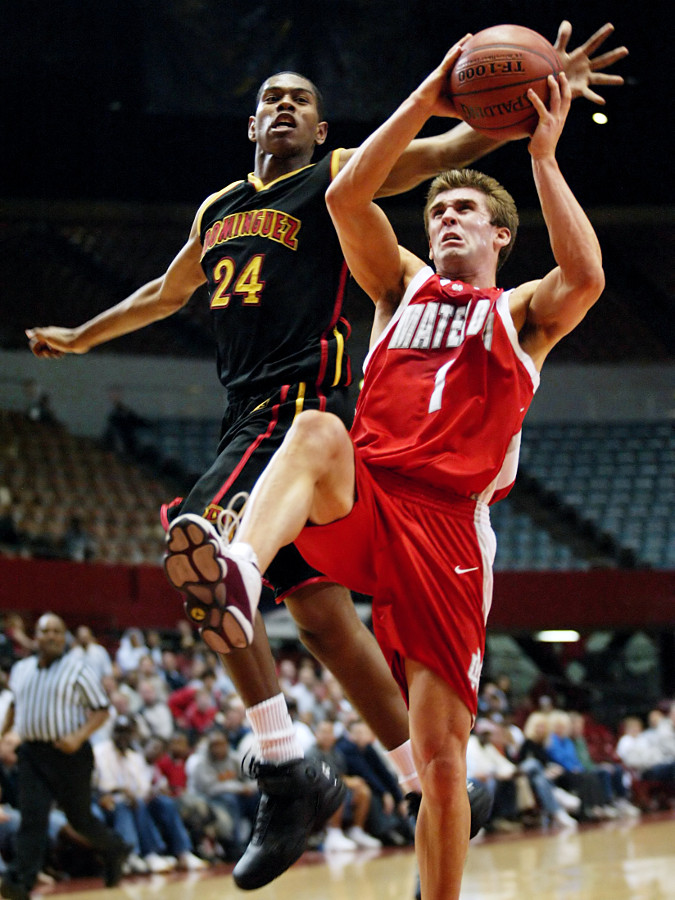 Dominguez guard Quinton Watkins tries to block Mater Dei guard Mike Gerrity during the CIF Southern Regional playoffs at the USC Sports Arena in Los Angeles on March 12, 2005. Mater Dei won 68-61, advancing to the state championship against Oak Ridge. Ho-Yen Tsang for The Orange County Register