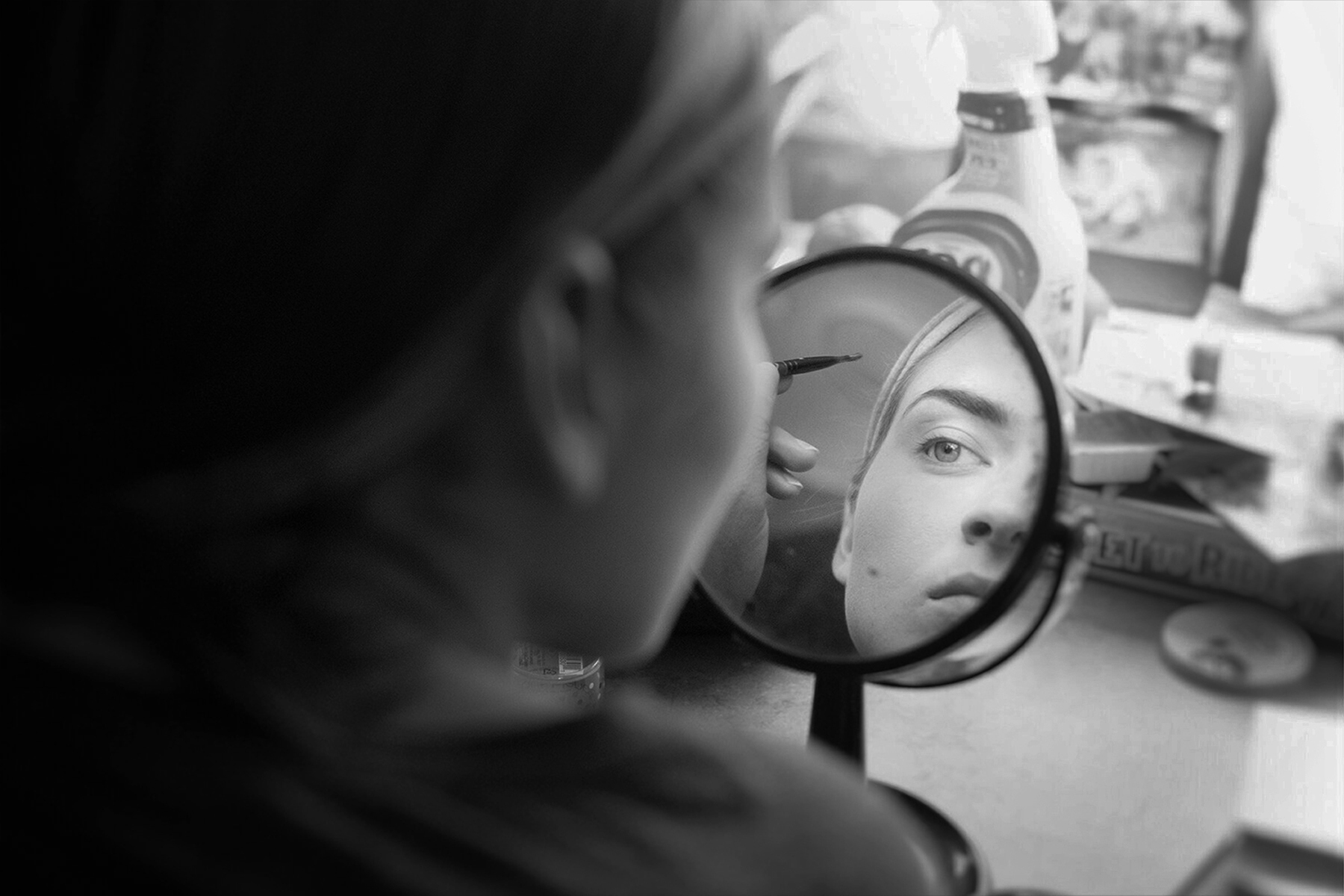 Miss Paulina puts on makeup and prepares for the act in her trailer.