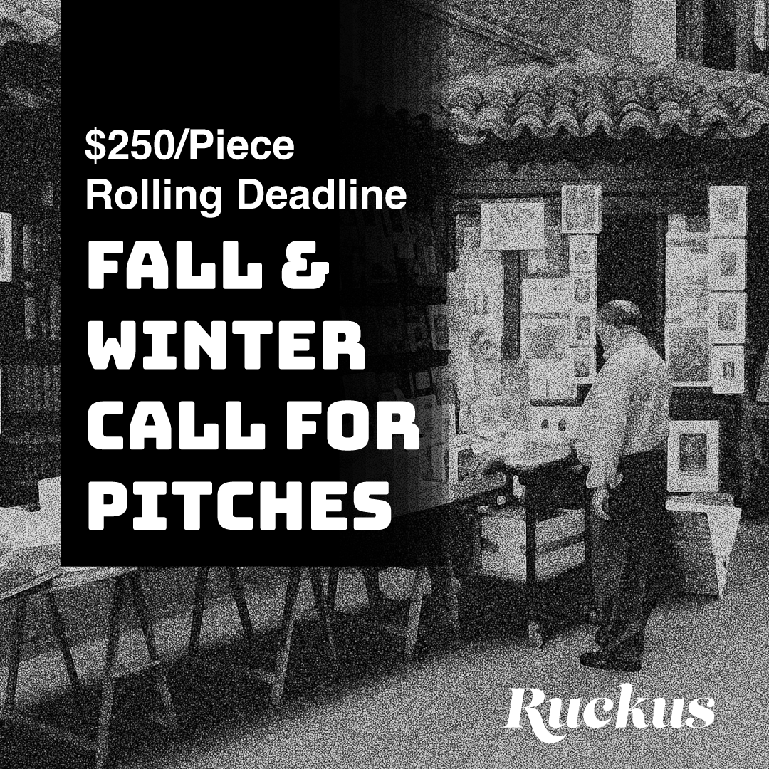 a grainy black and white photo of a lone post-work person in business attire staring somewhat joylessly at a row of books and periodicals in an outdoor sidewalk vendor. Superimposed over this in large white text over a black rectangle are the words “$250/Piece, Rolling Dealine Fall & Winter Call for Pitches,” and in the lower right hand corner is the script text Ruckus logo in white