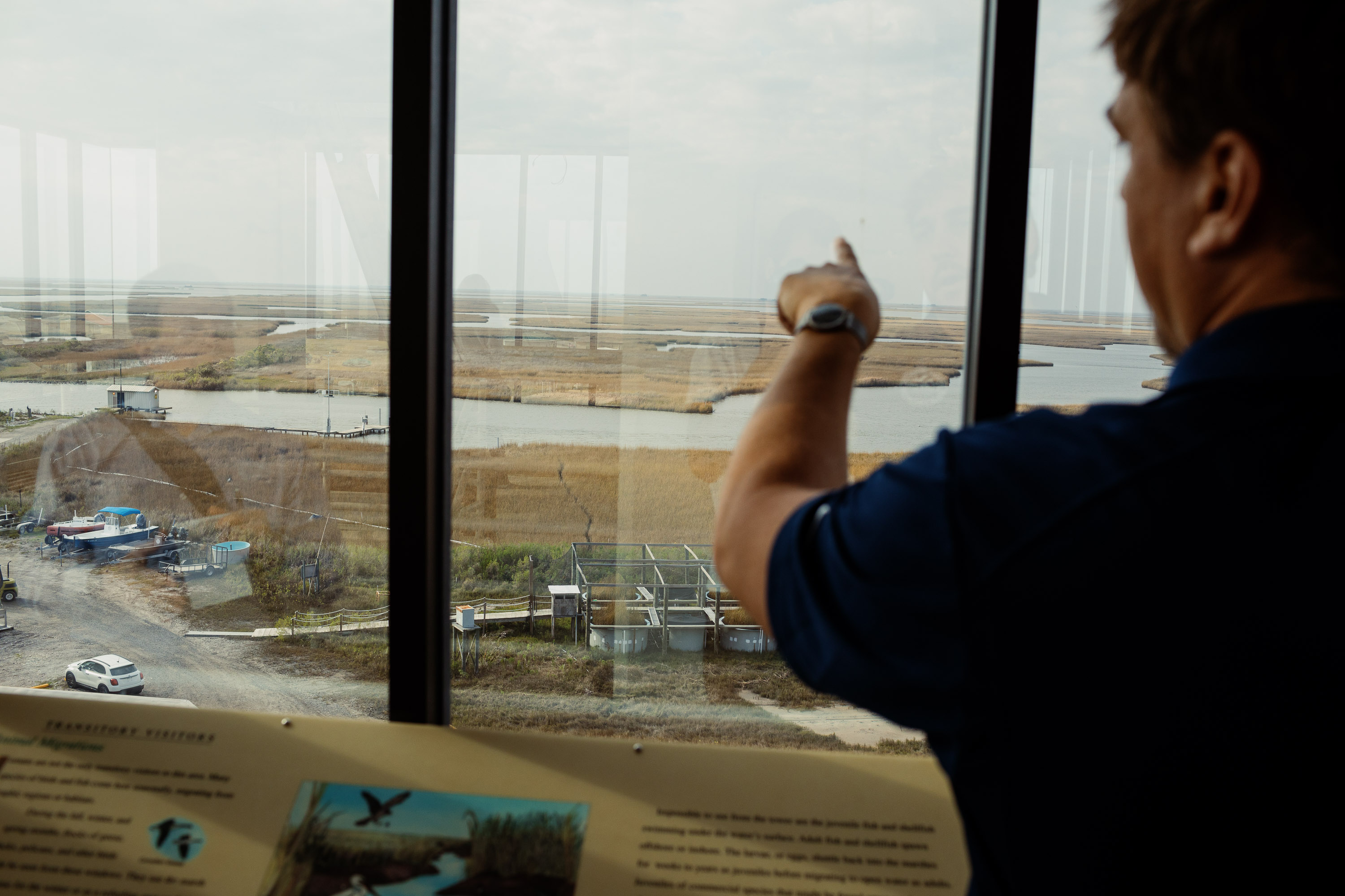 Brian Roberts, associate director of science at LUMCON explains where many of his research experiments are done in the marsh behind the facility.