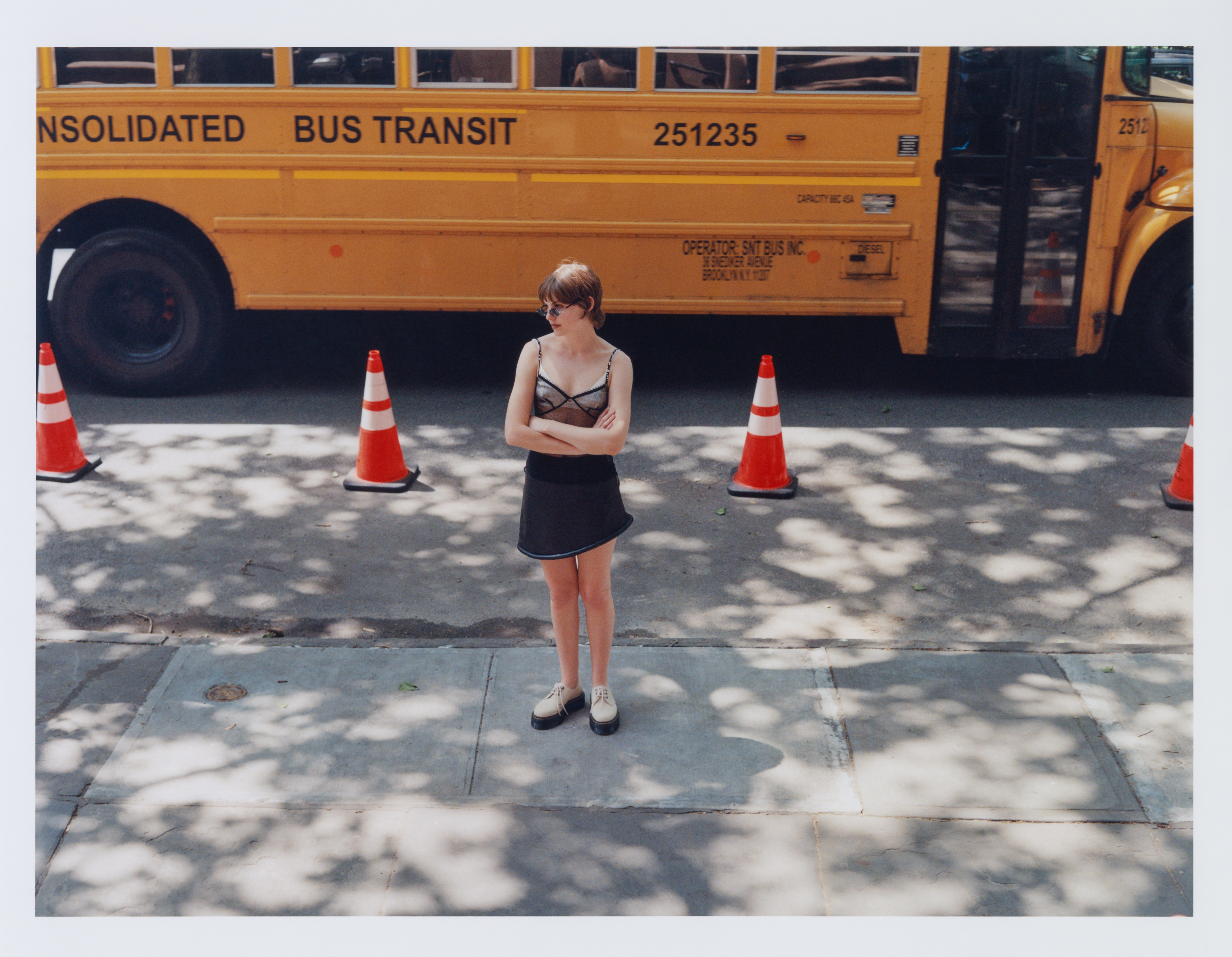 Chanel top, Simon Miller skirt, Dr. Marten’s shoes. Vintage sheer shrug, By Far sunglasses.
