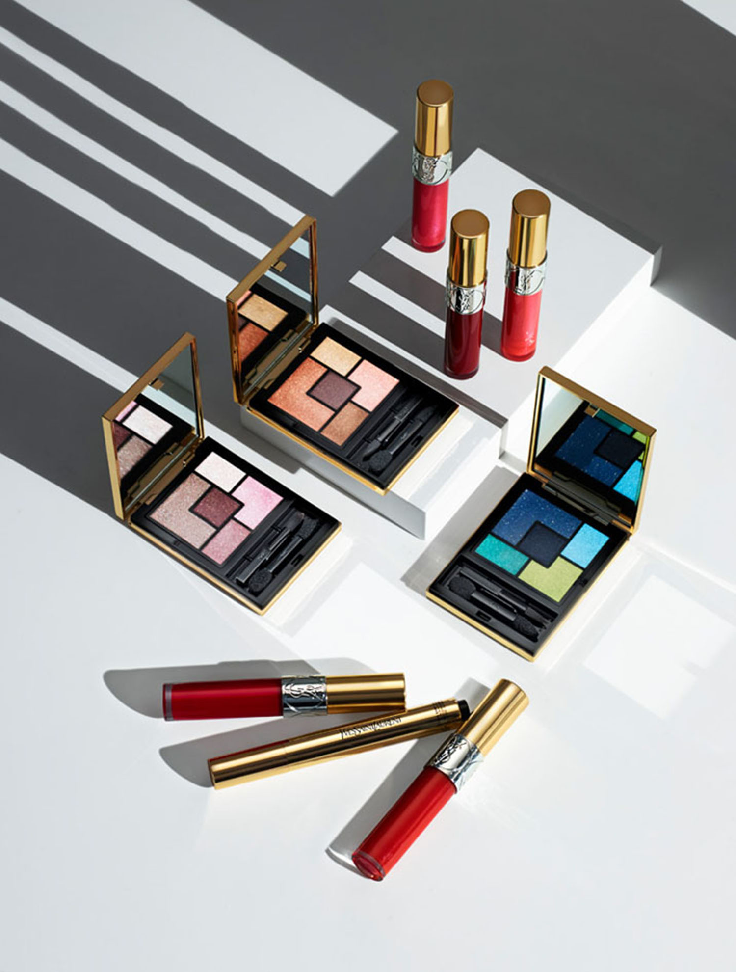 KMA stylist Sara Wacksman designs set for photo of many YSL beauty products using harsh lighting to create shadows 