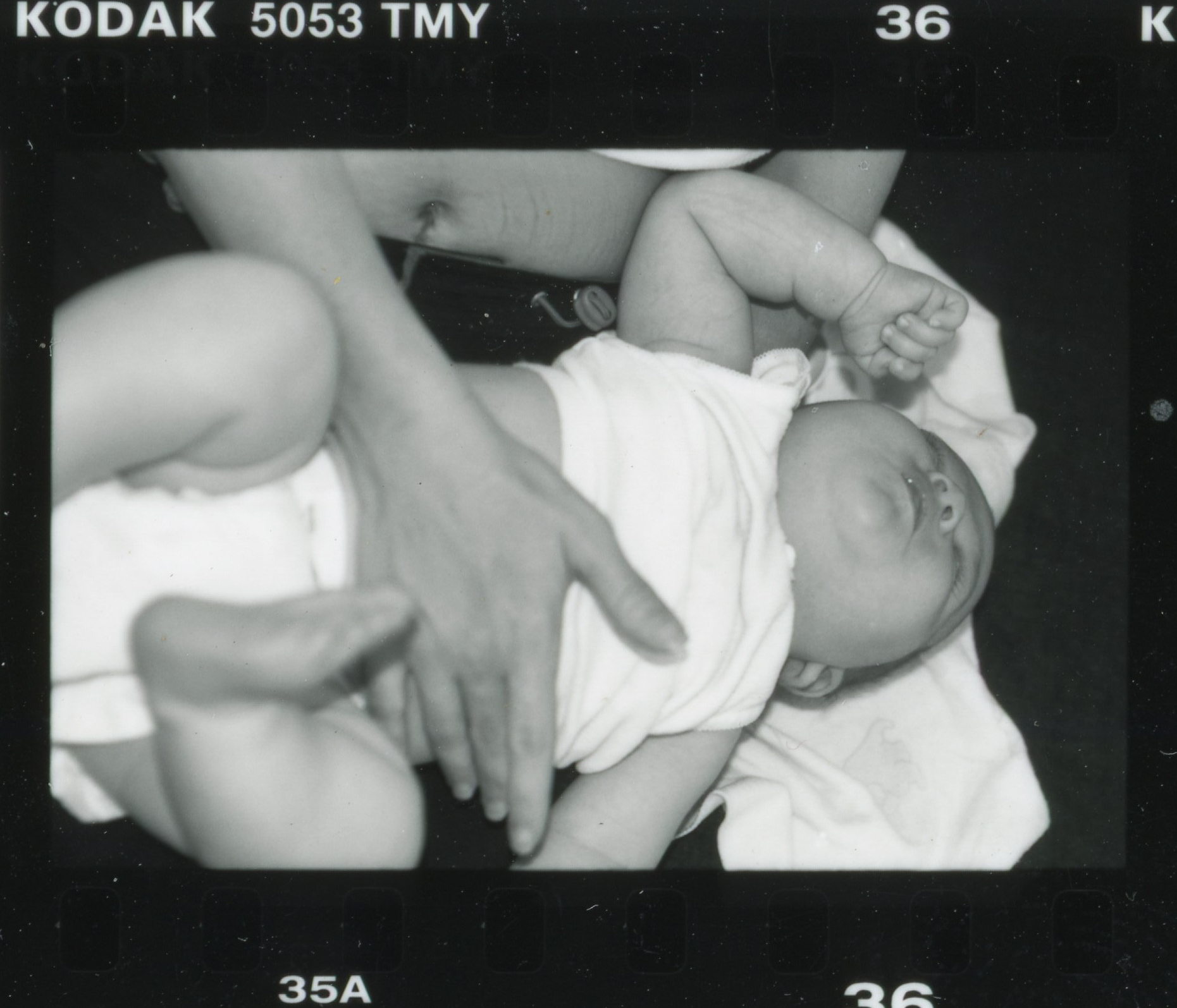 Leslie with her newborn. Archival photograph.