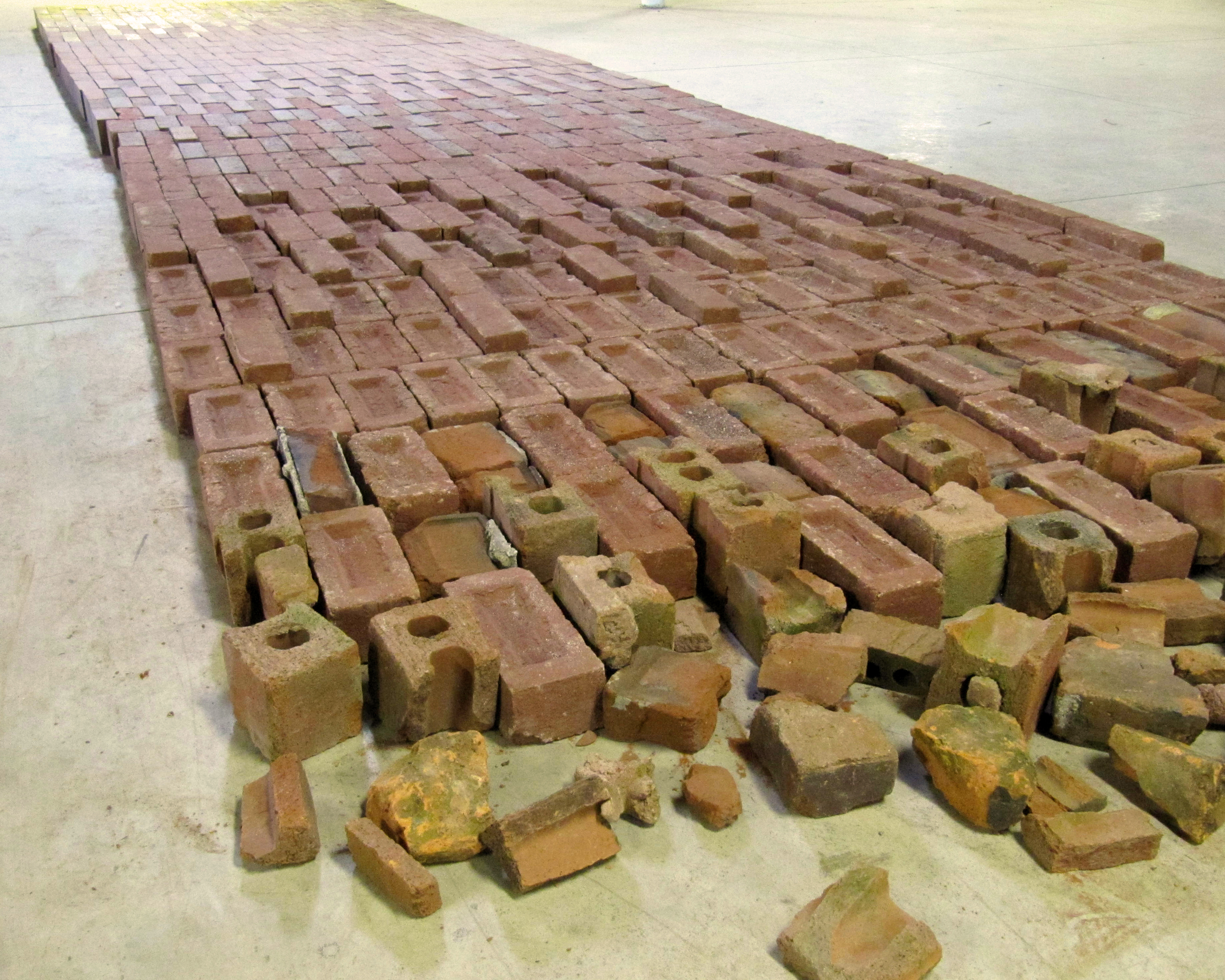 Some Kind of Way, 6 x 25 feet x 3.75 inches, 1,000 bricks and hot-pressed foil