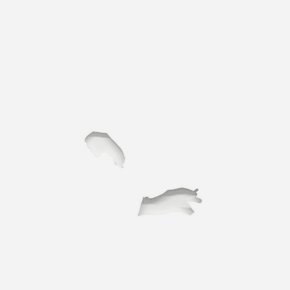 white paper with laser cut silhouette of two hands, one gesturing with a cigarette