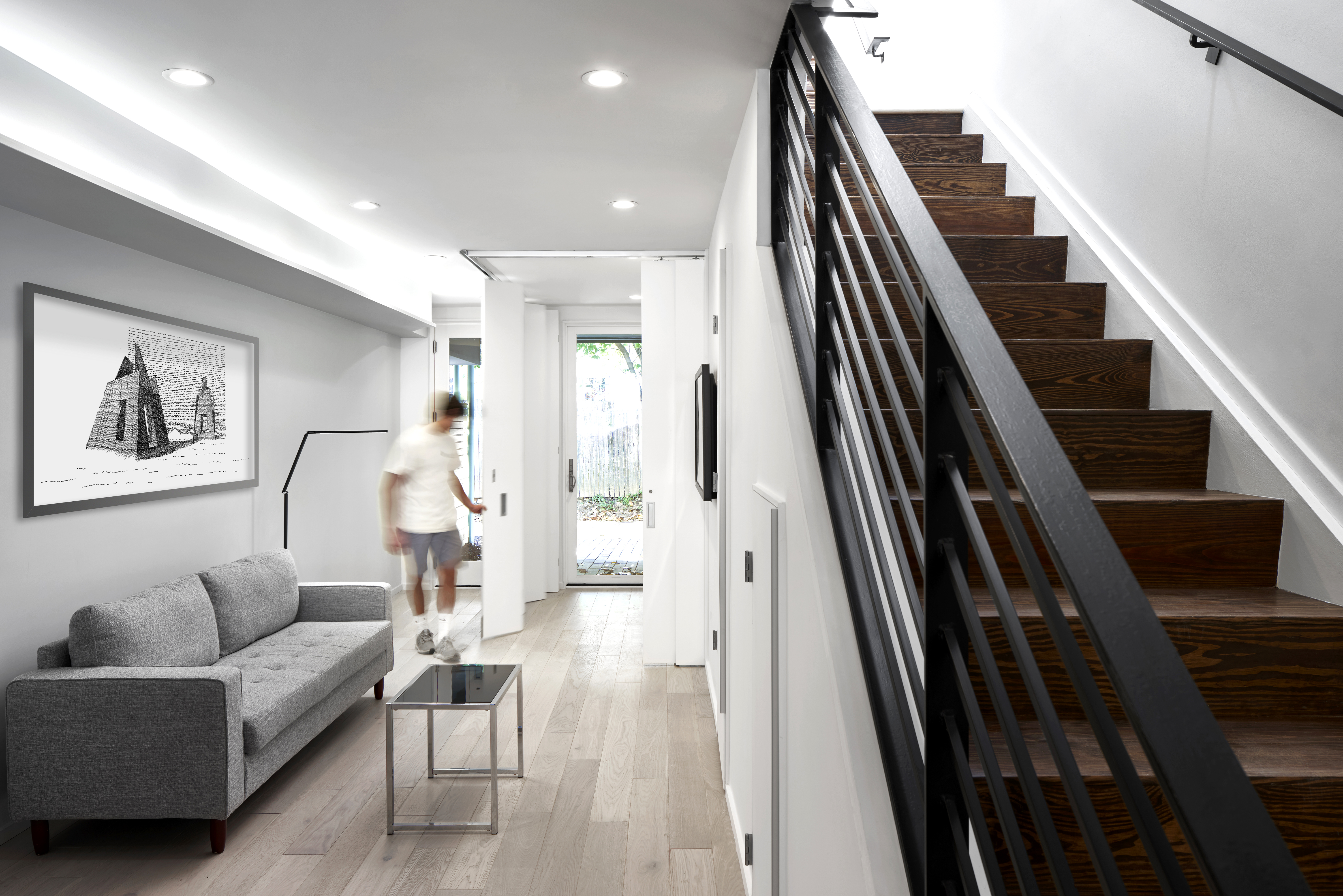 Typical unit living area looking toward rear parking pad