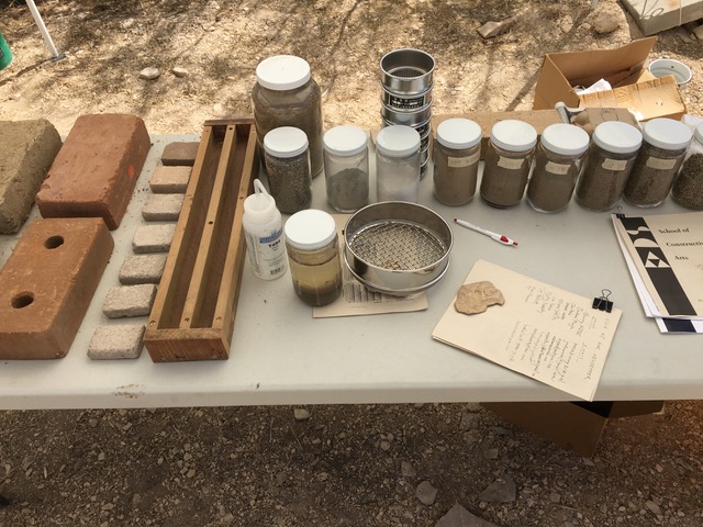 Earth block and soil testing display at the Terlingua Community Garden