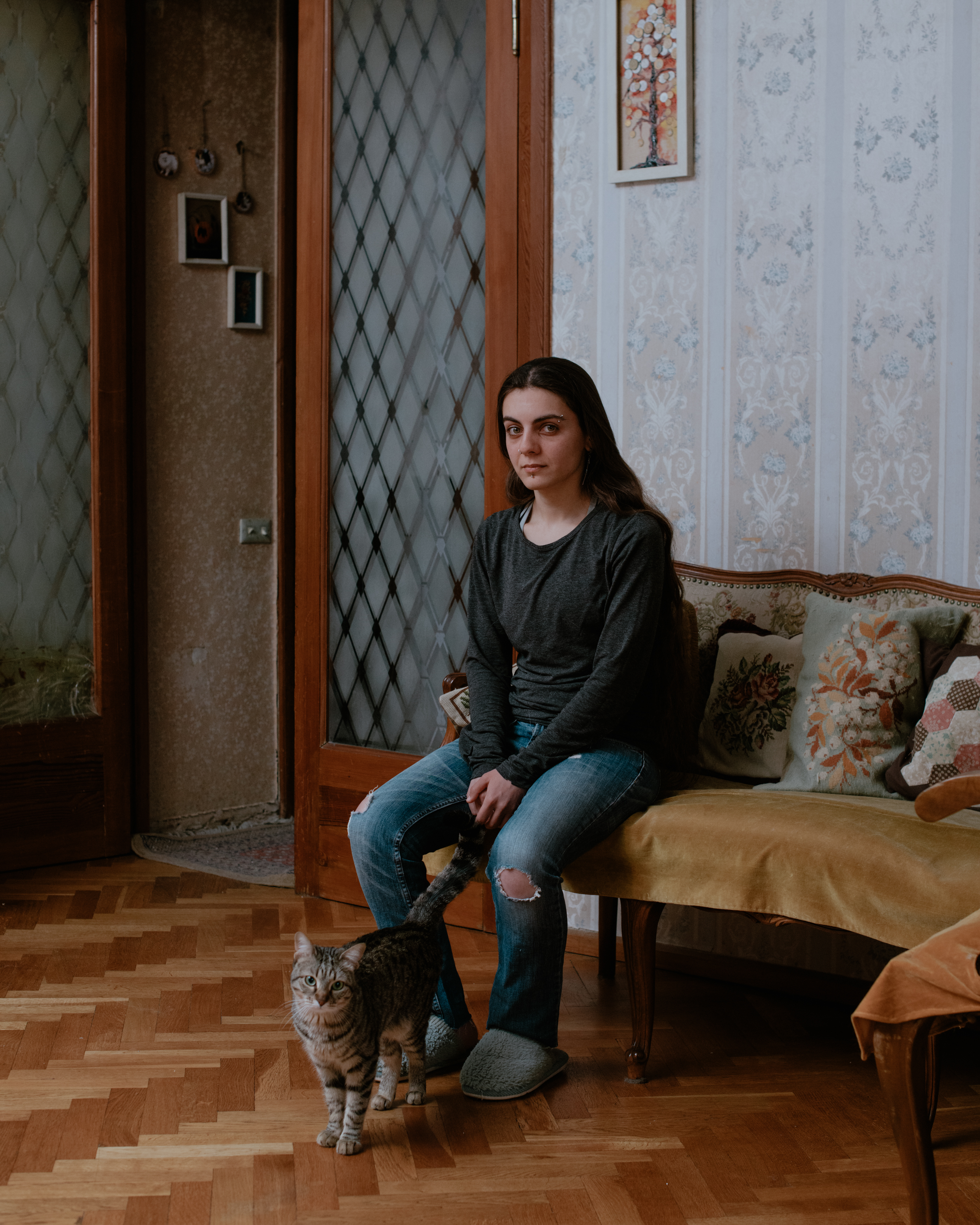 “I live here with my mother and our five cats. During the Soviet time, it was easier to get a good job. My mother was a doctor at that time. I deliver food. One day I would like to leave Georgia. My dream is to live in New Zealand.” - Sally