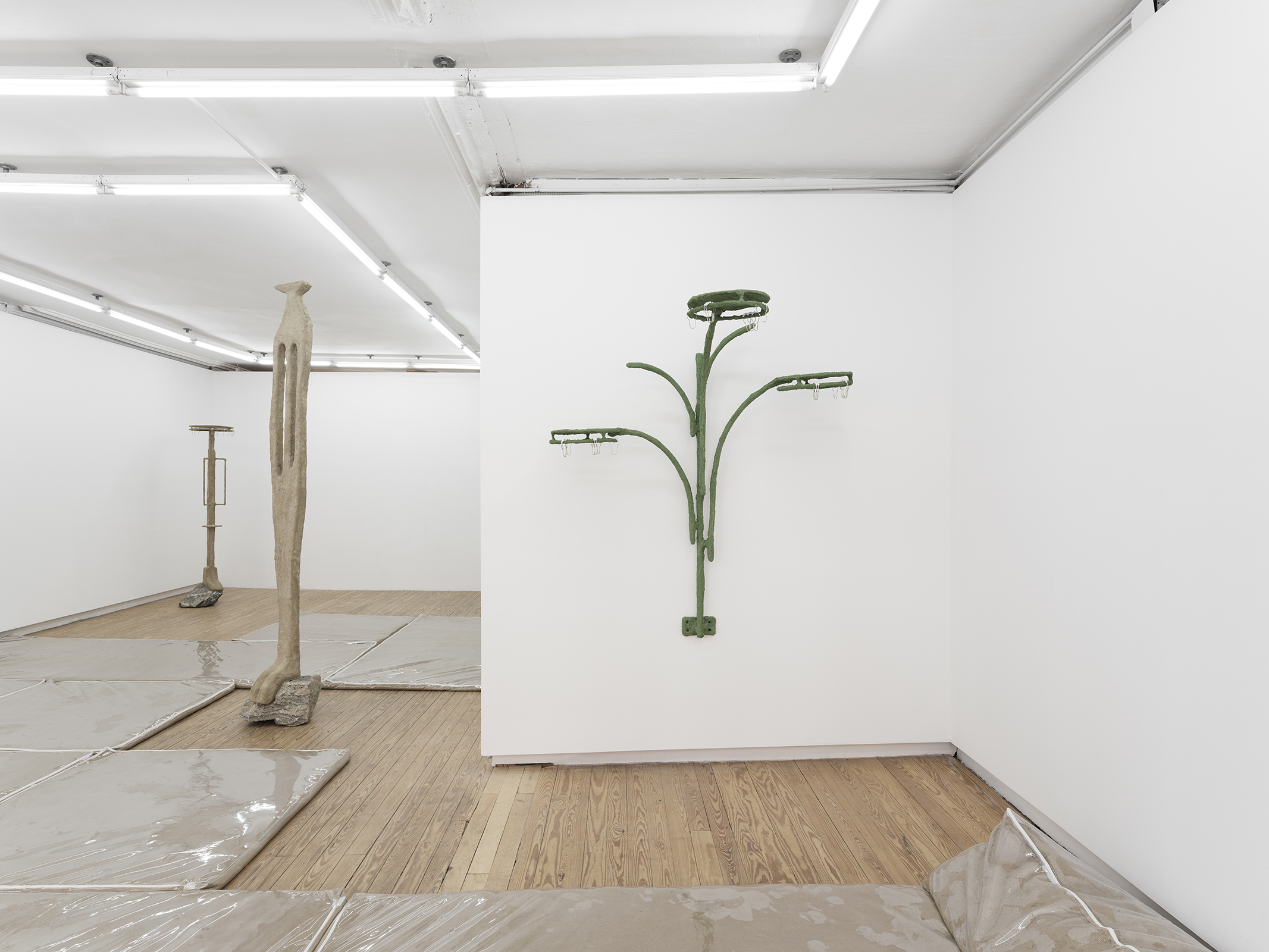 Lone And Level, 2021, vinyl, sand, polymer, burlap, steel, rock, plaster, pigment, shower curtain hooks