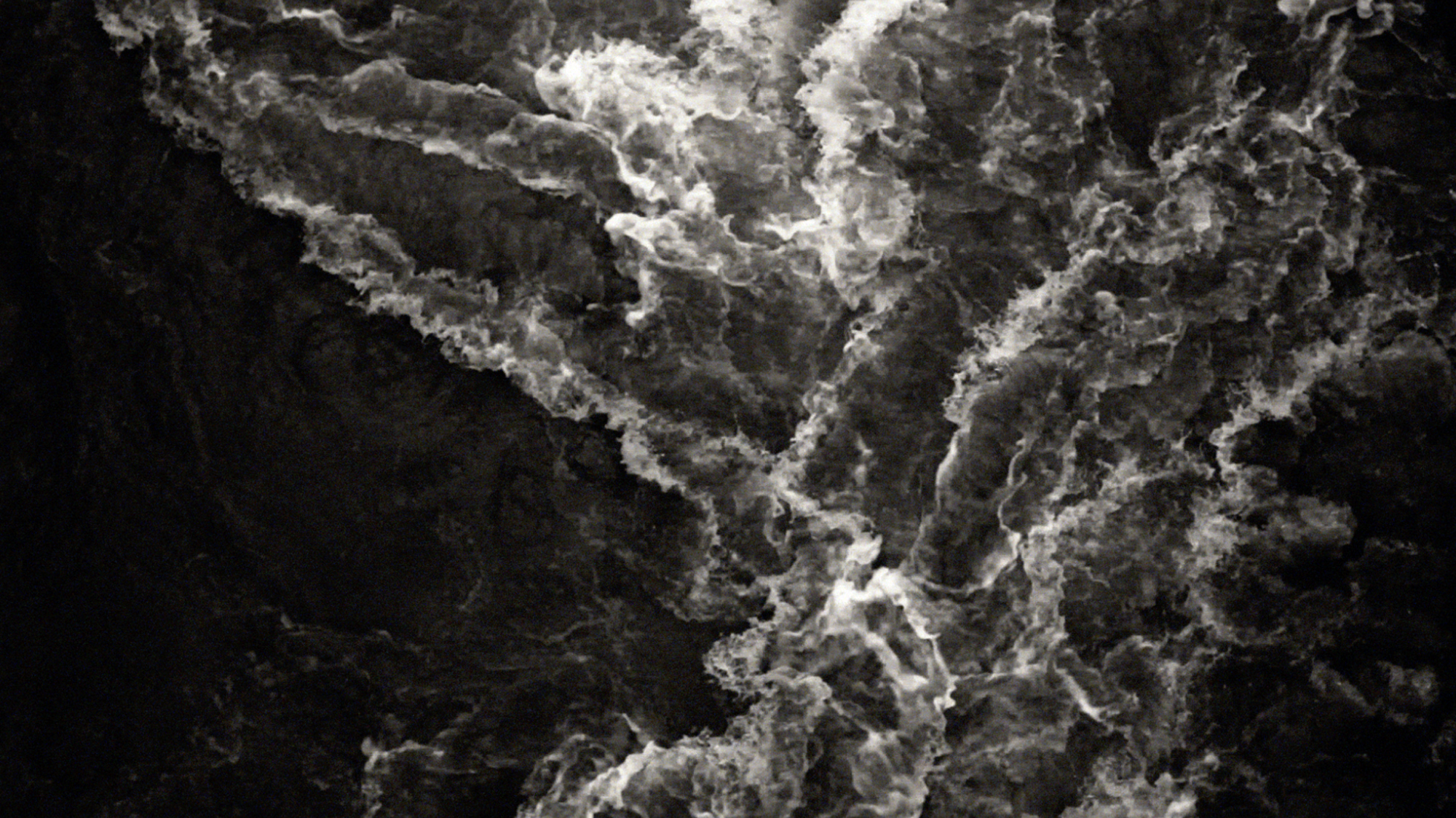 At Any Given Moment, River 3, 2018; video projection:16mm film screened as single-channel video projected at architectural scale, color, sound by Matteo Liberatore; duration 4 minutes. (still frame)