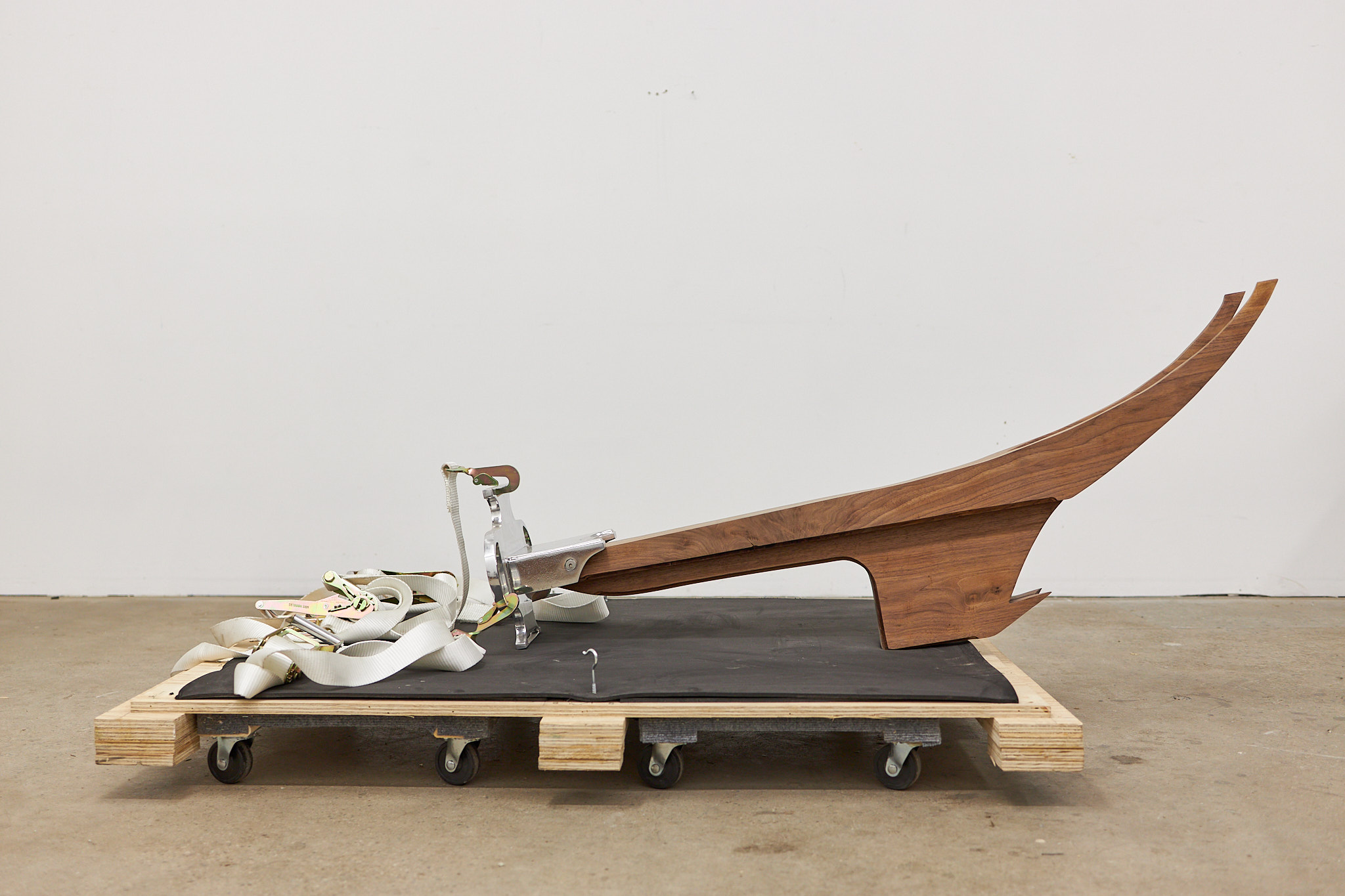 Evil-Evading Roof Eaves for every Modern building. 2022 Black Walnut, aluminum, rachet straps, wooden pallet 36” x 10” x 24"