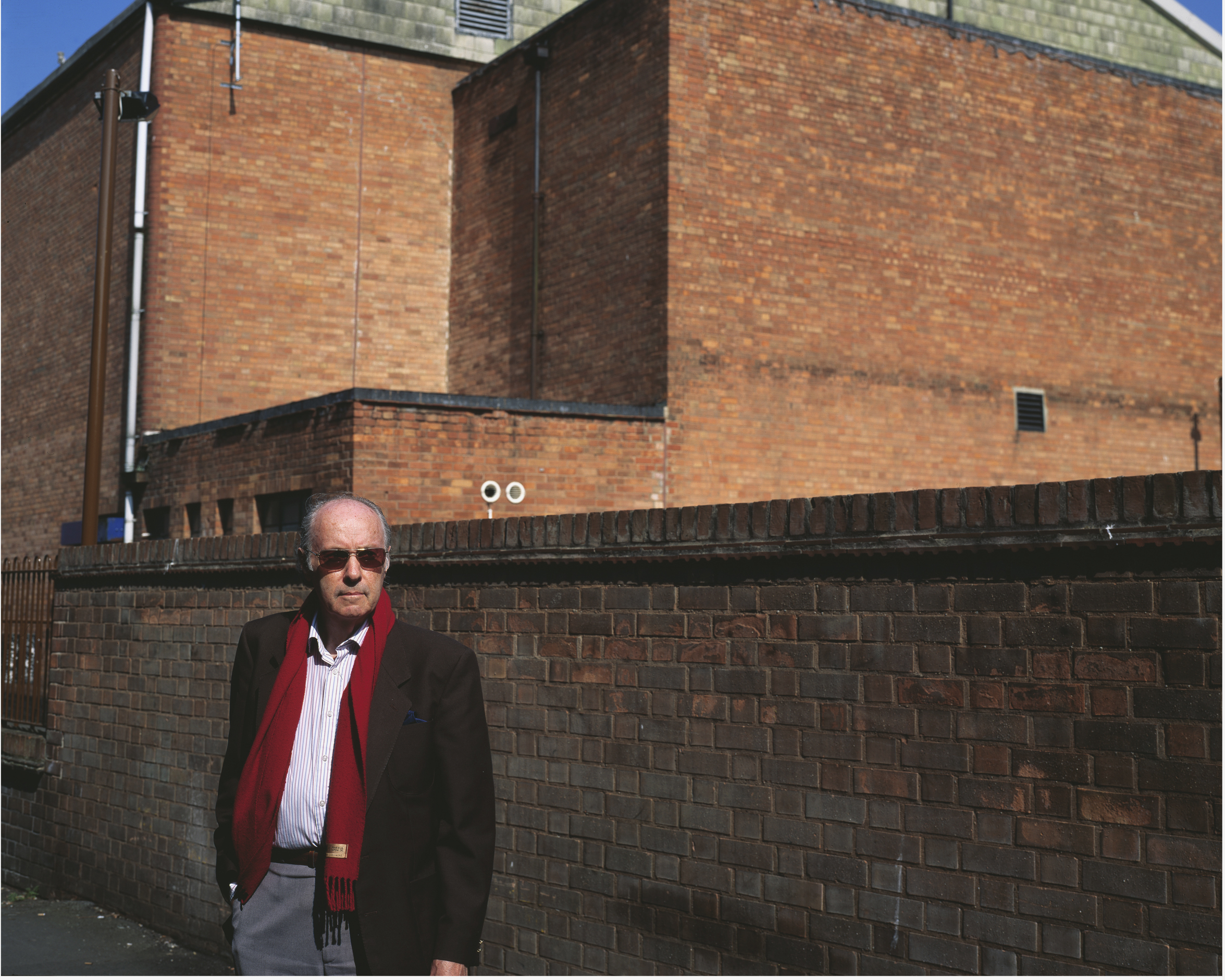 Sunglasses, red scarf and brick. May 2011.