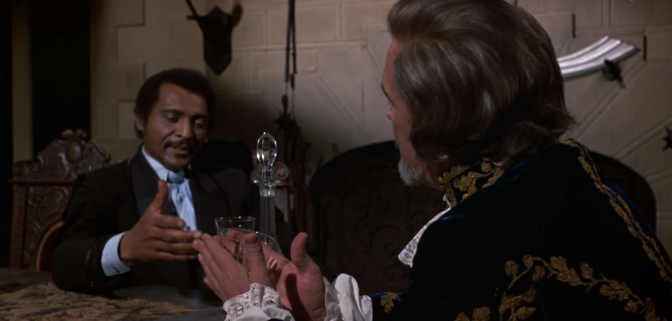 Mamuwalde (William Marshall) and Count Dracula (Charles Macaulay) discuss stopping the Trans-Atlantic Slave Trade in Blacula.