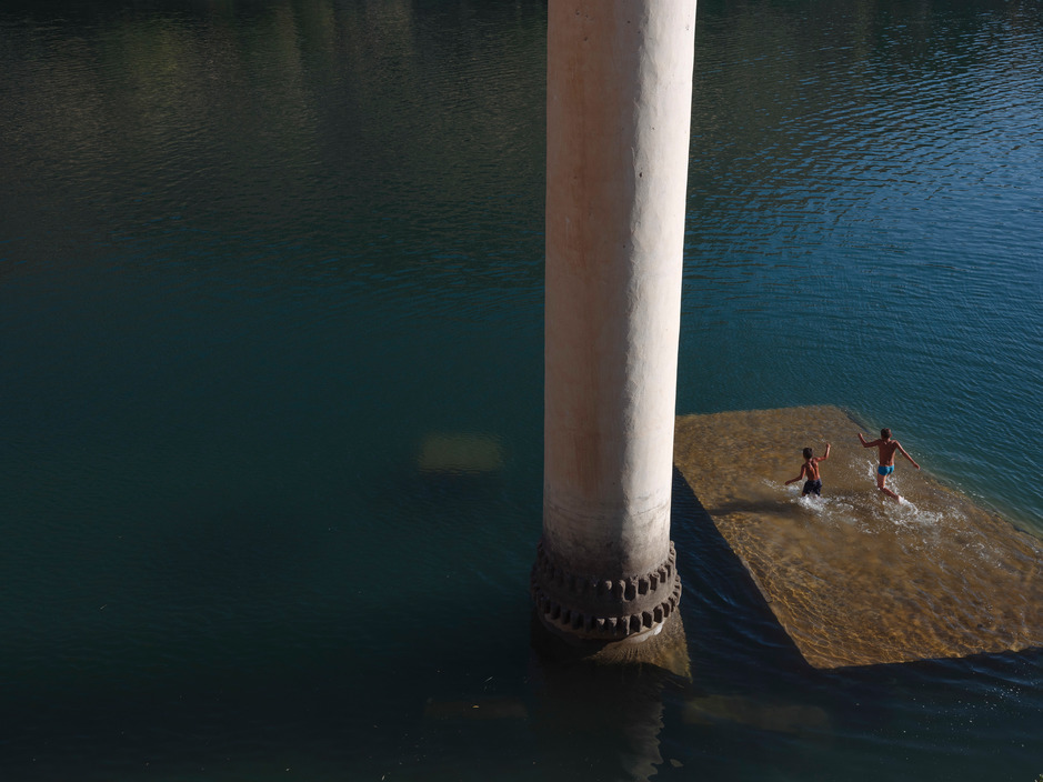  Emin Ozmen, Children Play in the Water, on the Roof of a Partially Sunken Mosque in Savasan, 2018