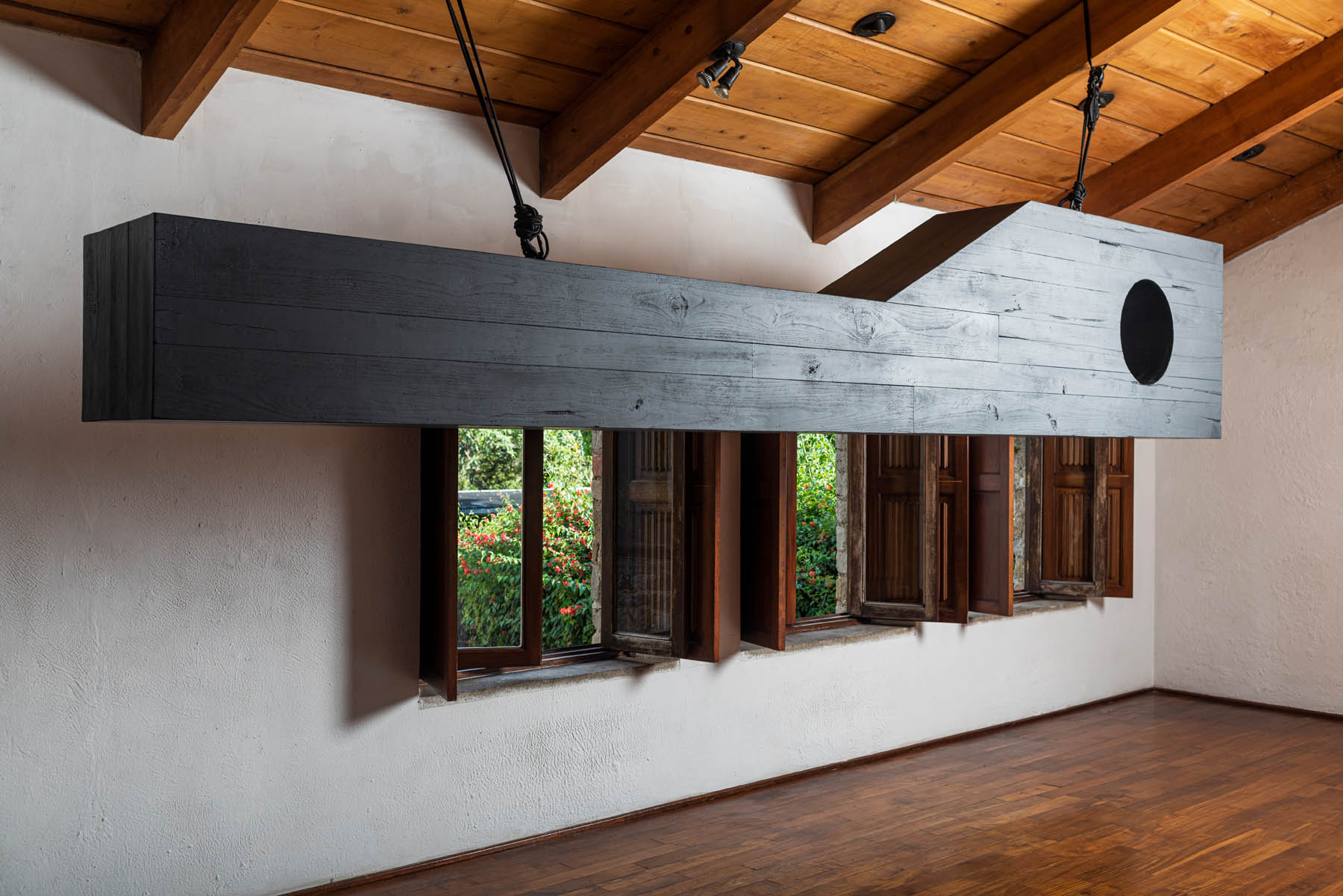 Story of a Differentiated Space, burned teka wood, 450 x 100 cm. 2022.