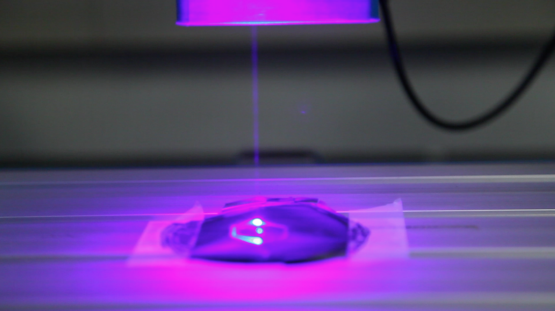 Glowing pink/purple object.
