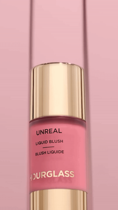 KMA stylist Rachel Haas designs set for photo of many shades of concealer sticks on black background for Hourglass 