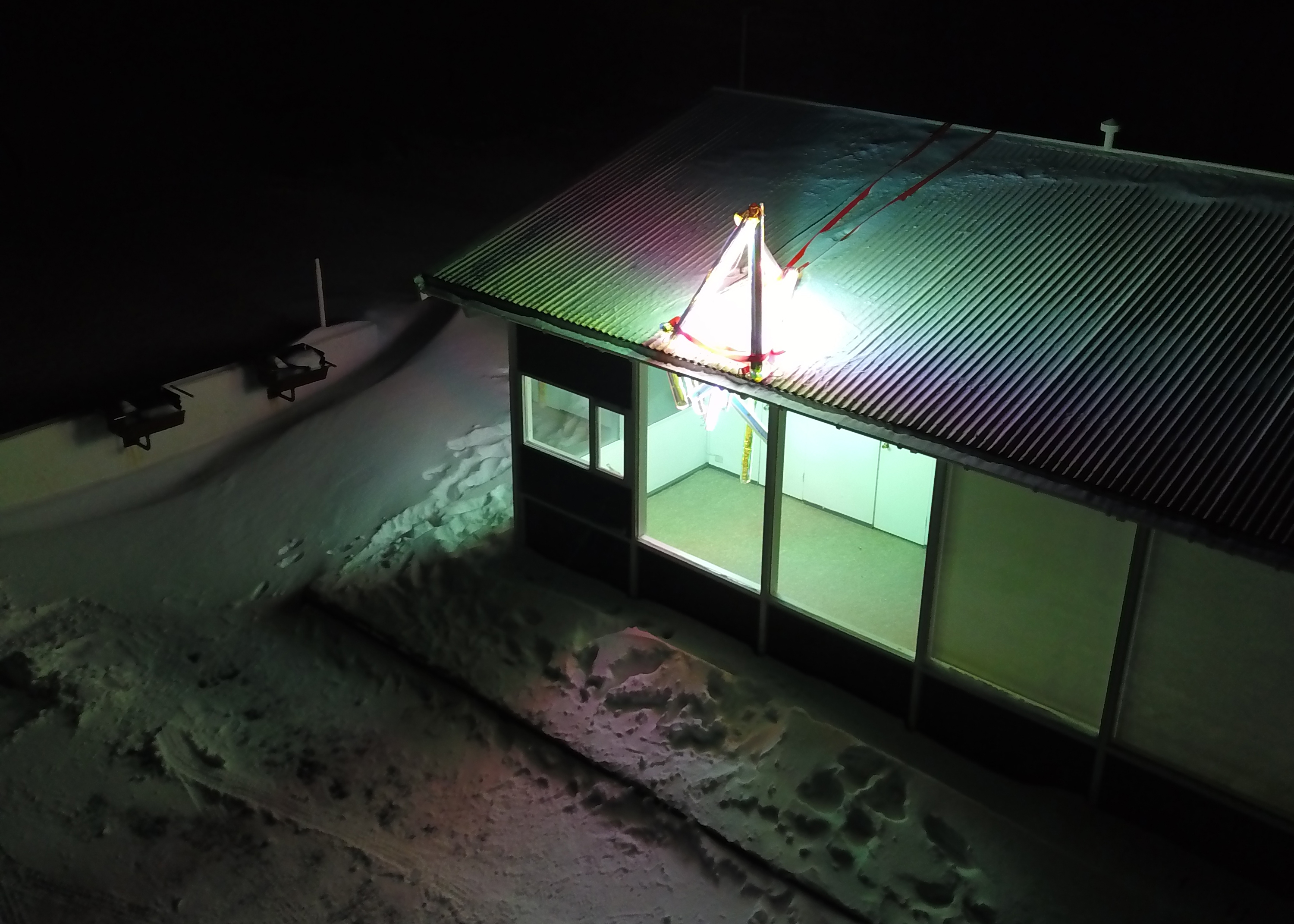 "Convene with an Ineffable Eminence" dichroic film and florescent lighting, Seyðisfjörður Campground Office