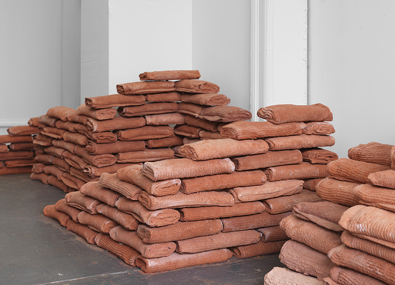 Untitled (towel bricks), 2015, hand towels, plaster, pigment, brick dust