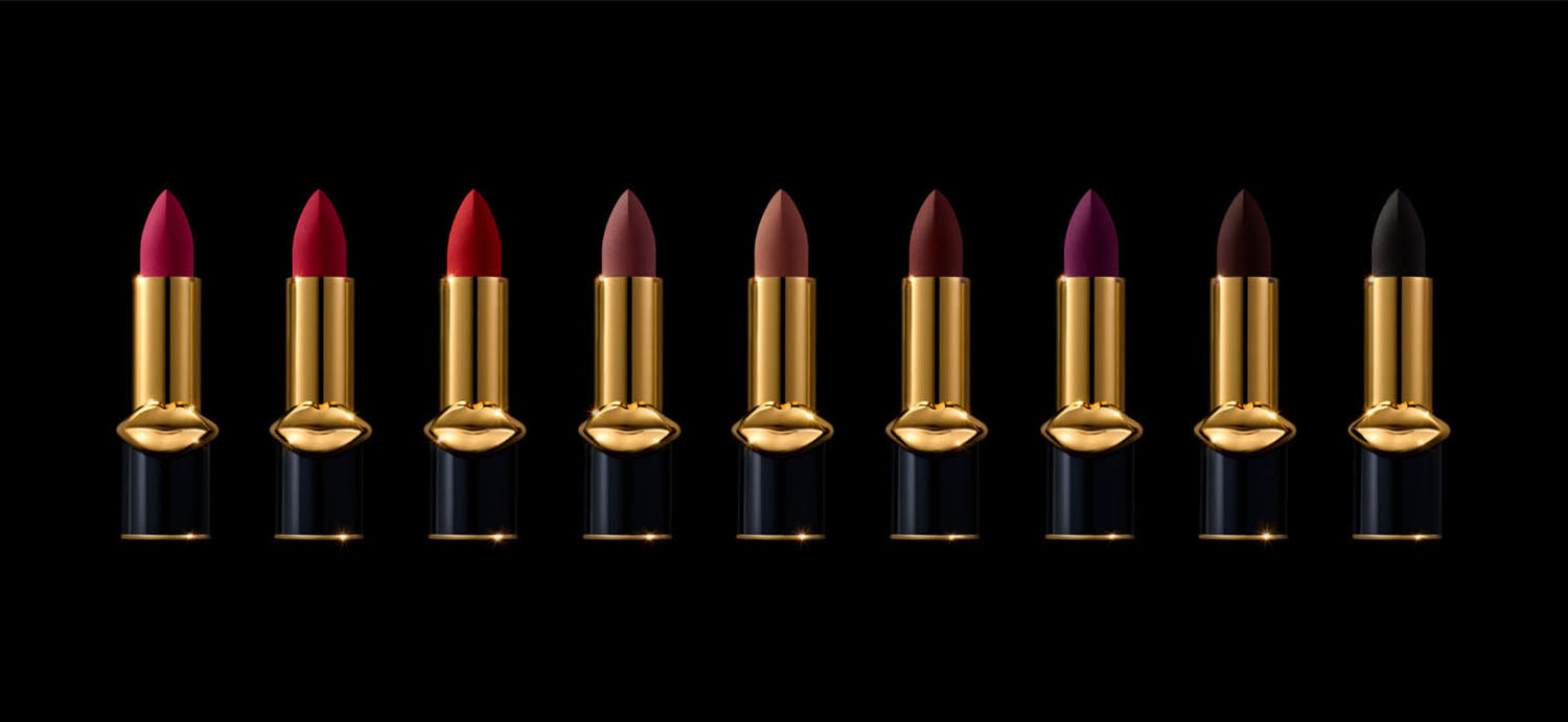 KMA stylist Sara Wacksman designs set for photo of many lipstick shades in a line with a black background for Pat McGrath