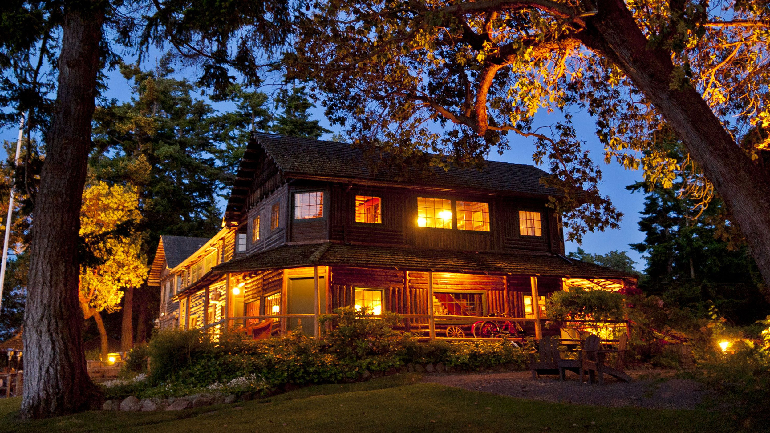 The Captain Whidbey Inn lodge at night. Pacific Northwest cabin rentals and one of the best lodges in Washington State.