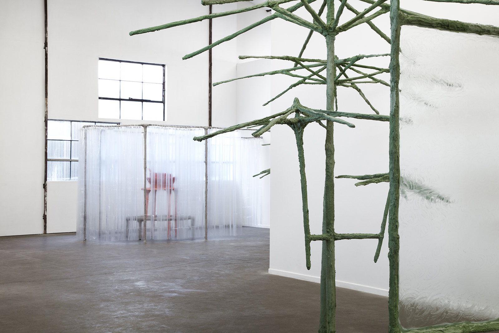 One in the mouth and one in the heart, 2018, umbrellas, steel, plaster, burlap, sand, pigment, glass, vaseline, shower curtains